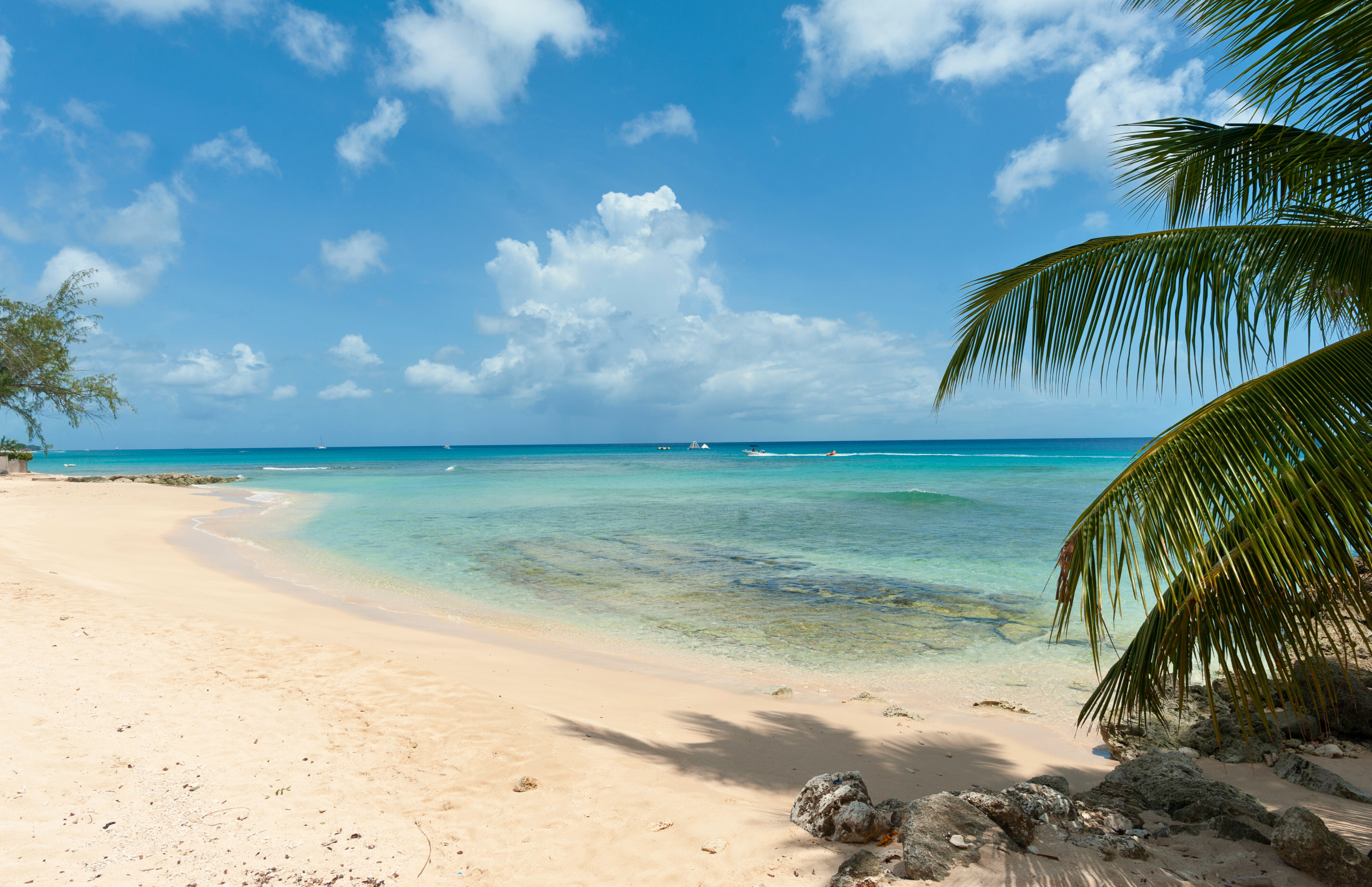 Steps from a serene turquoise beach with soft sand and tropical views