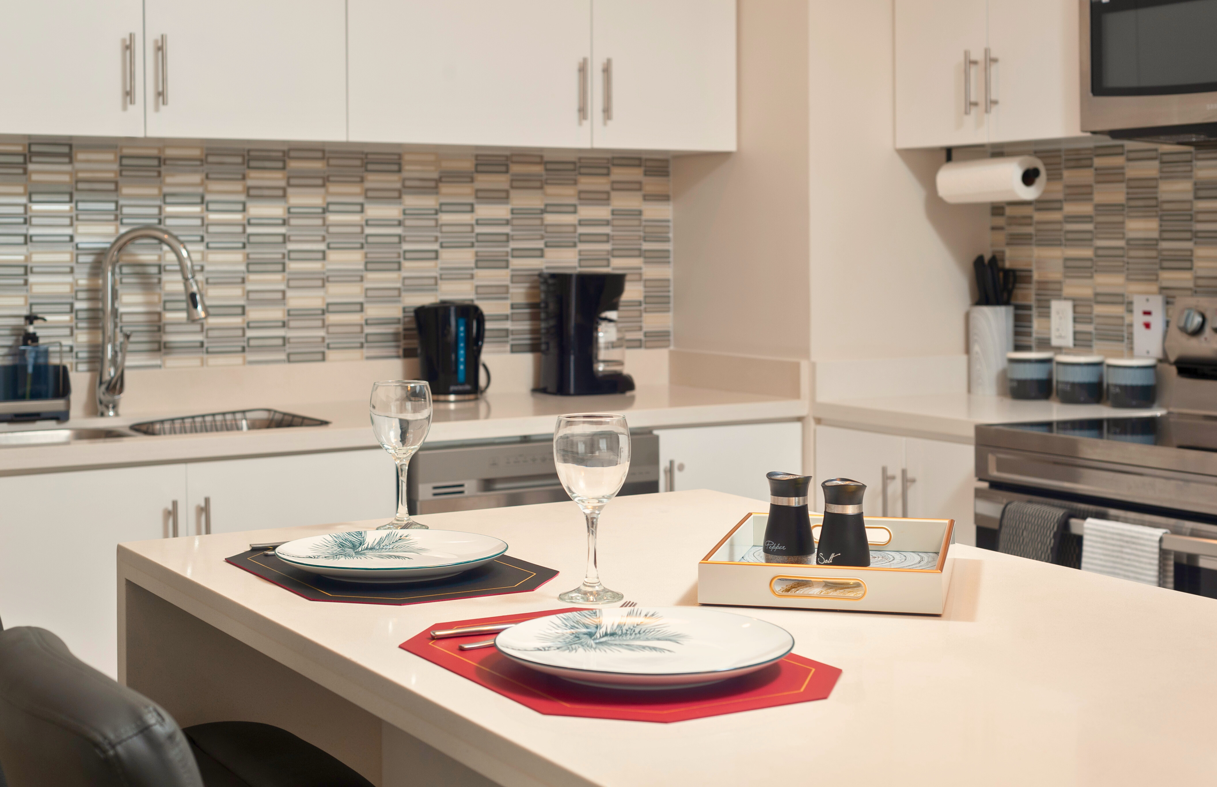 Bright modern kitchen with island dining set for two