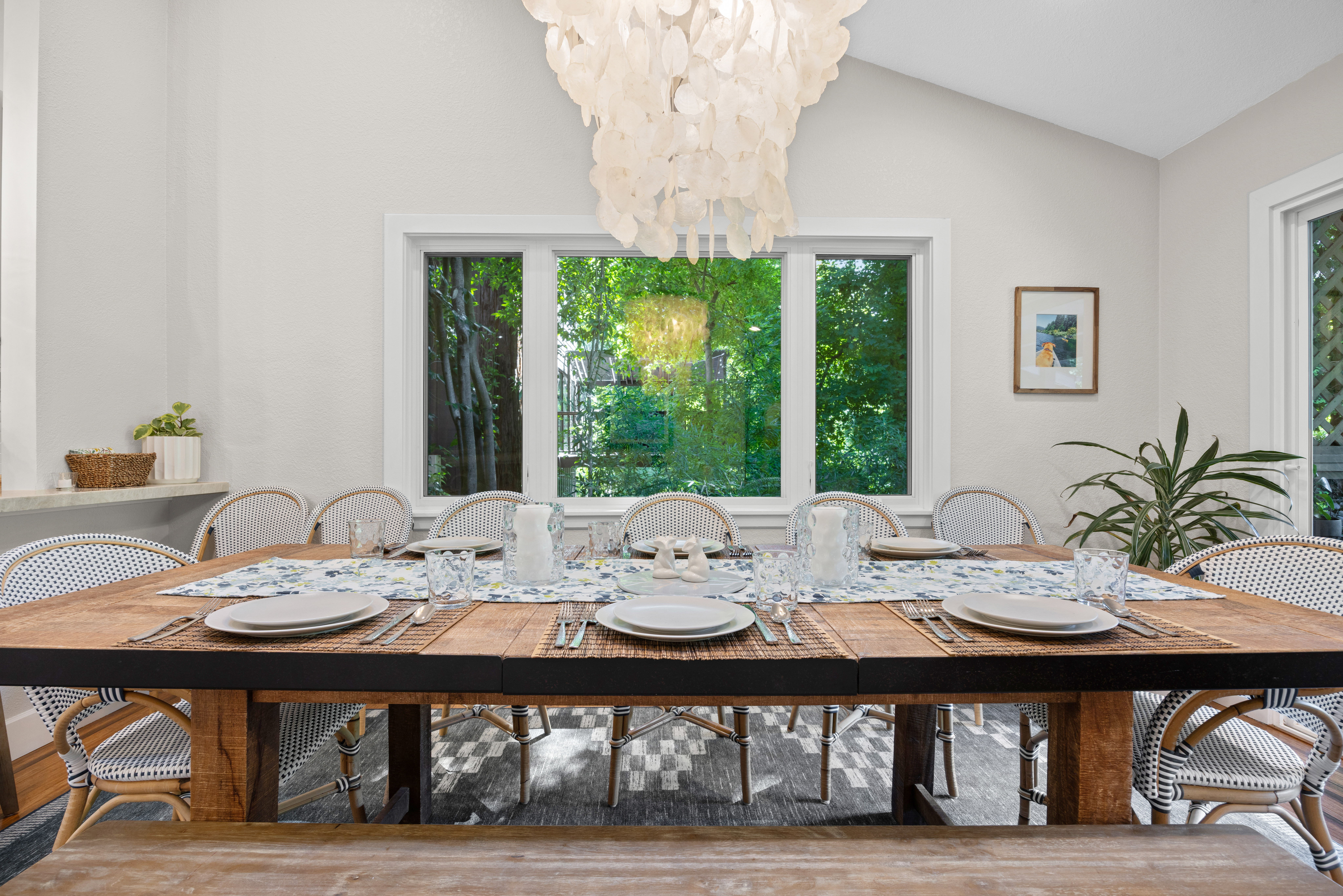 Bright dining room with seating for 8, garden views, and stylish design