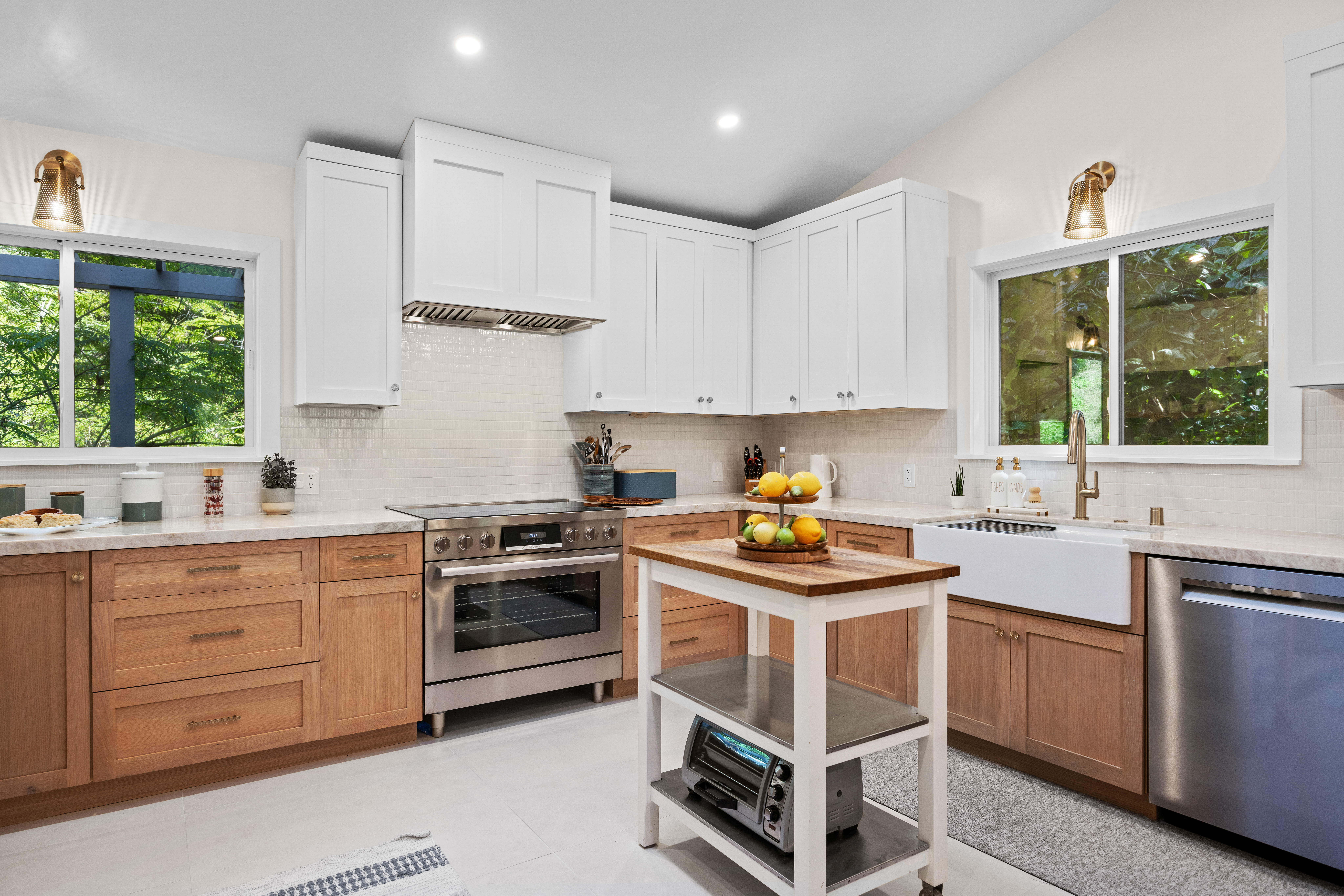 Bright modern kitchen with farmhouse sink and charming prep island