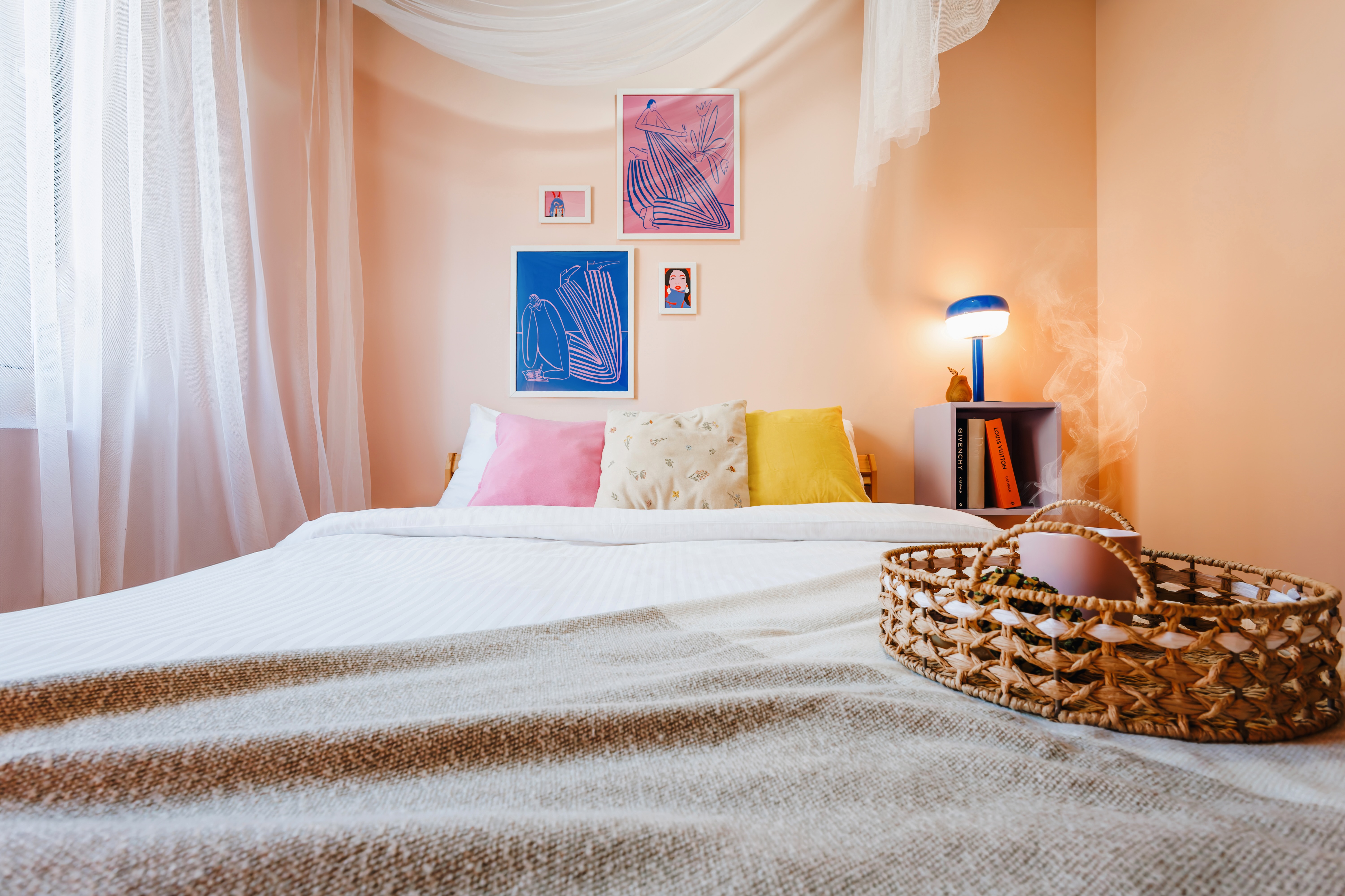 Charming pastel bedroom with cozy linens and boutique-style decor