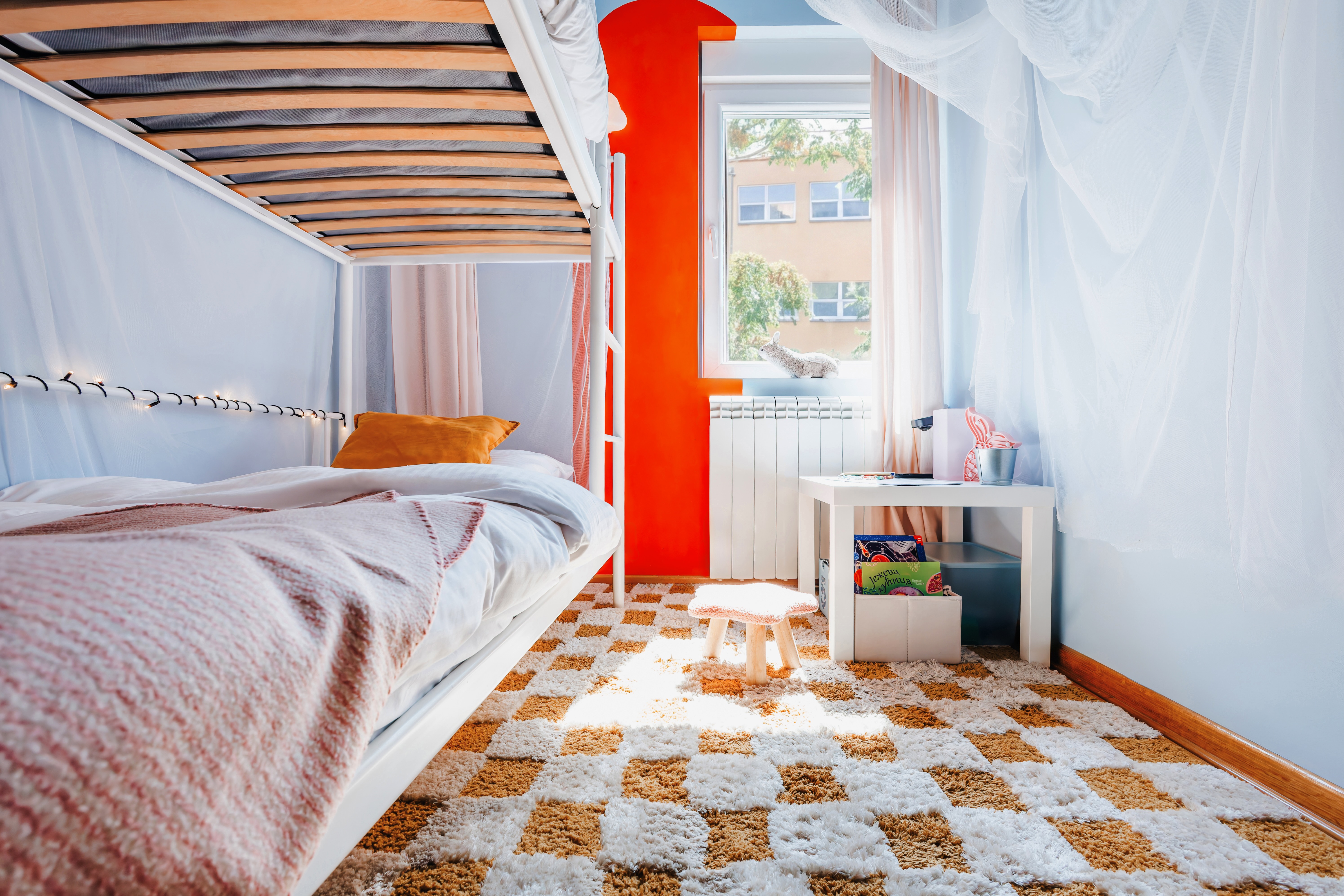 Bright family-friendly bunk room with playful design and soft natural light