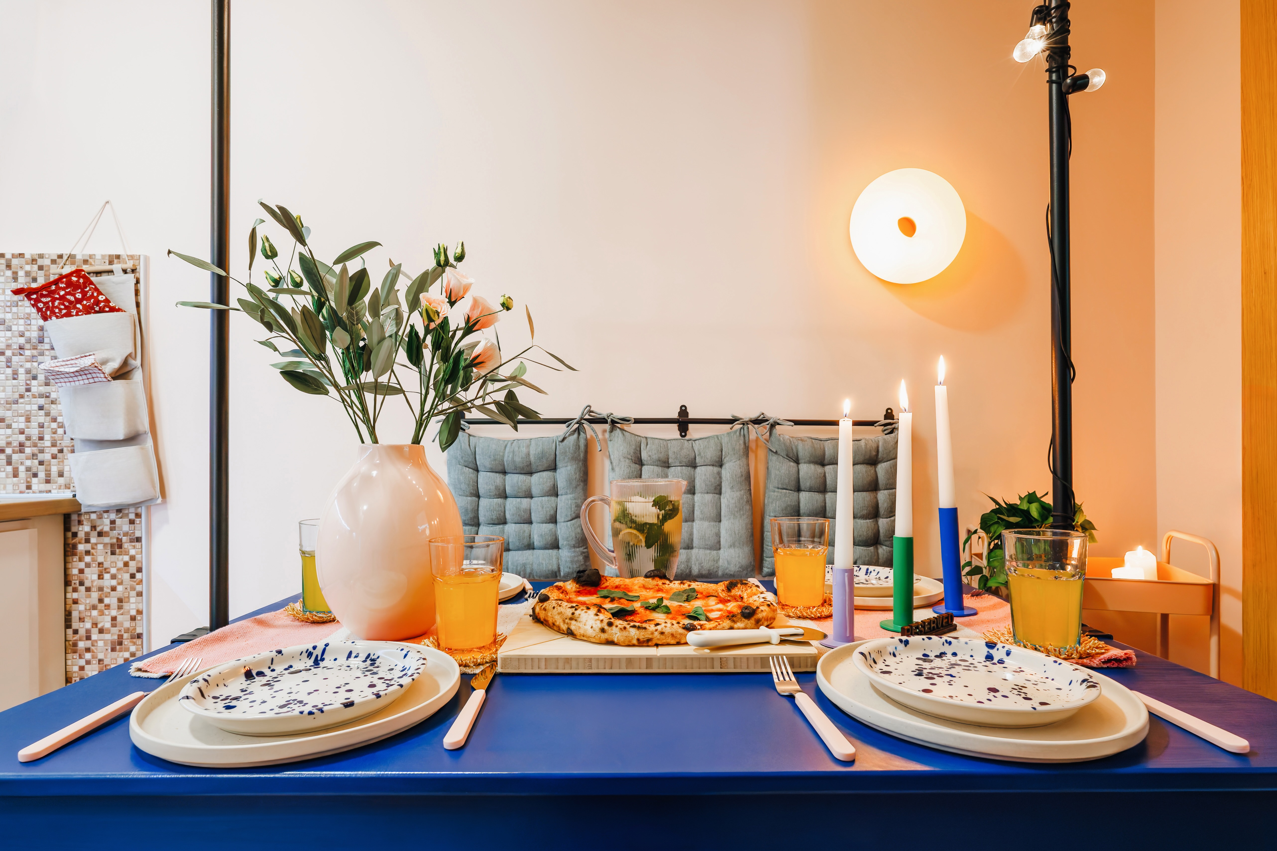 Chic candlelit dining nook with stylish decor and cozy ambiance