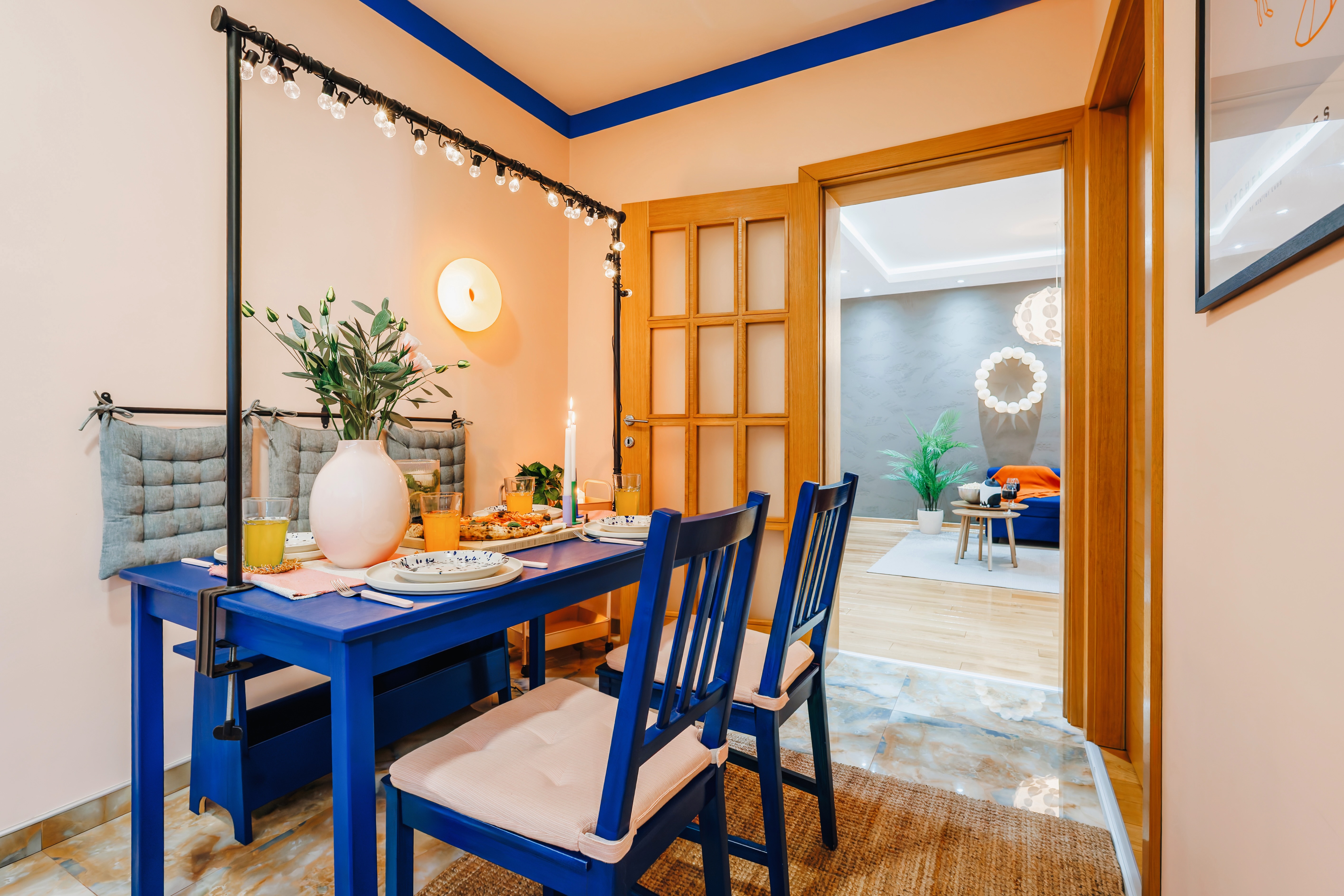 Cozy blue-accent dining area with elegant table setting and warm ambiance
