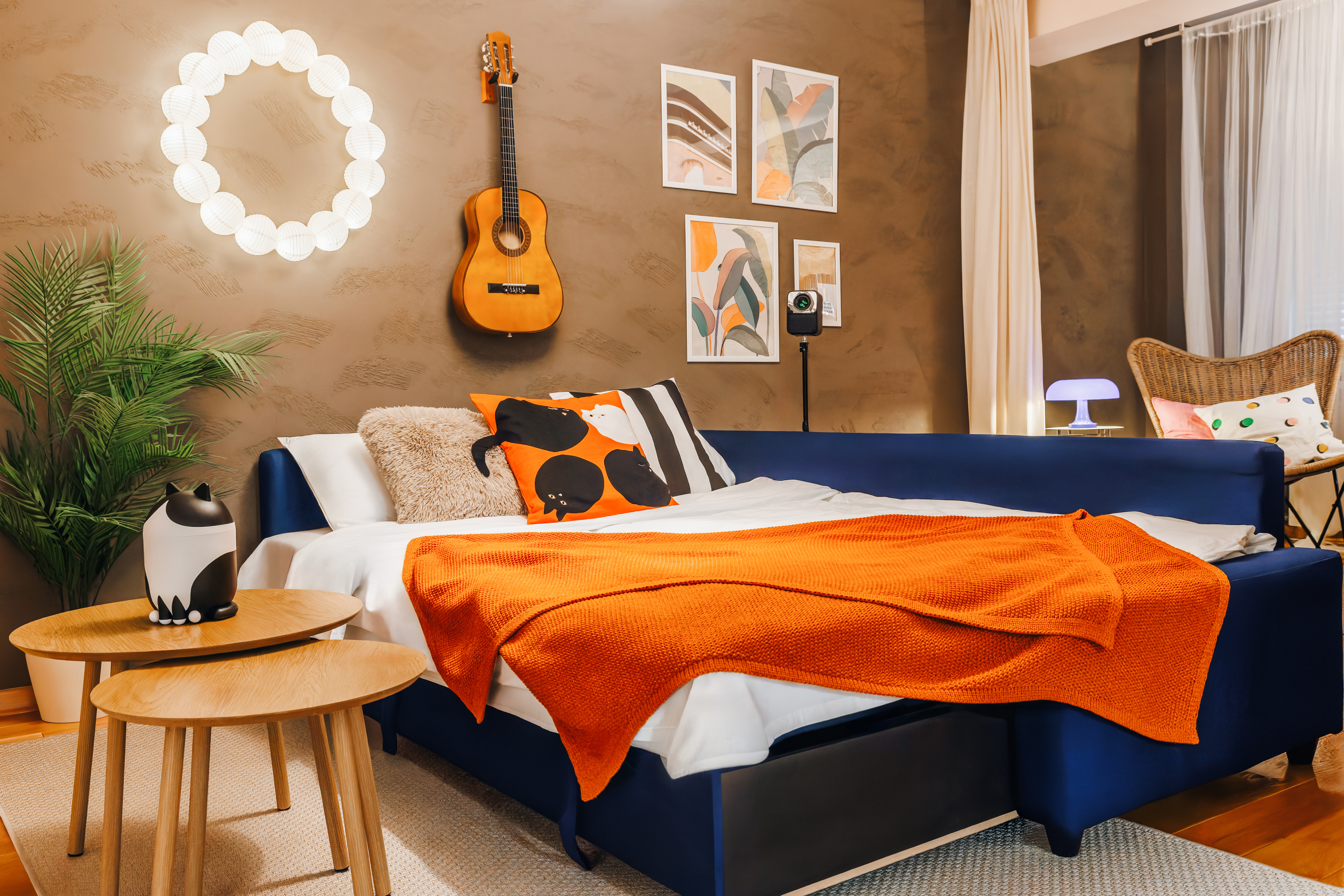 Stylish boutique bedroom with bold decor, cozy lighting, and artistic flair