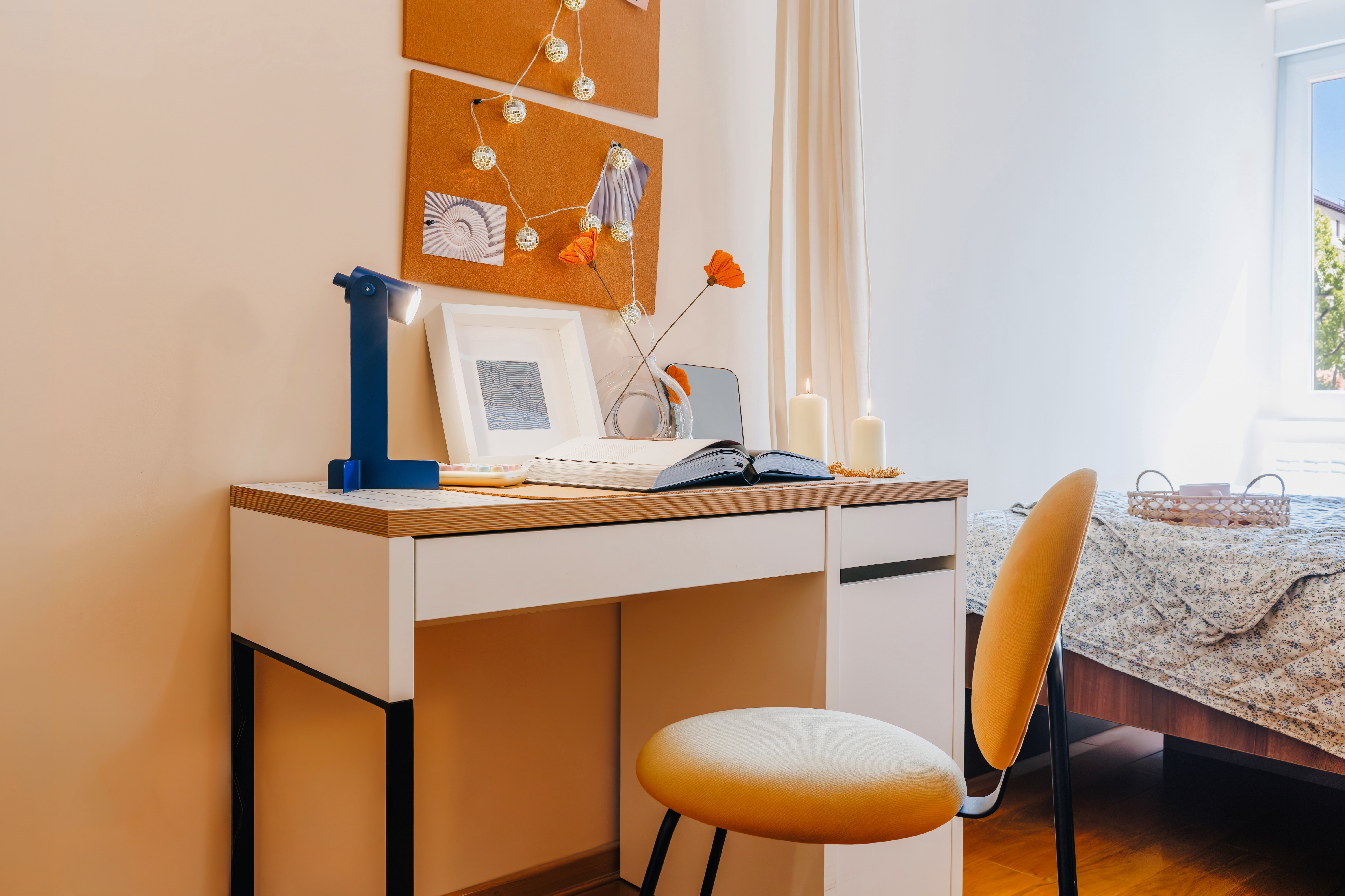 Bright bedroom with cozy workspace and stylish modern decor