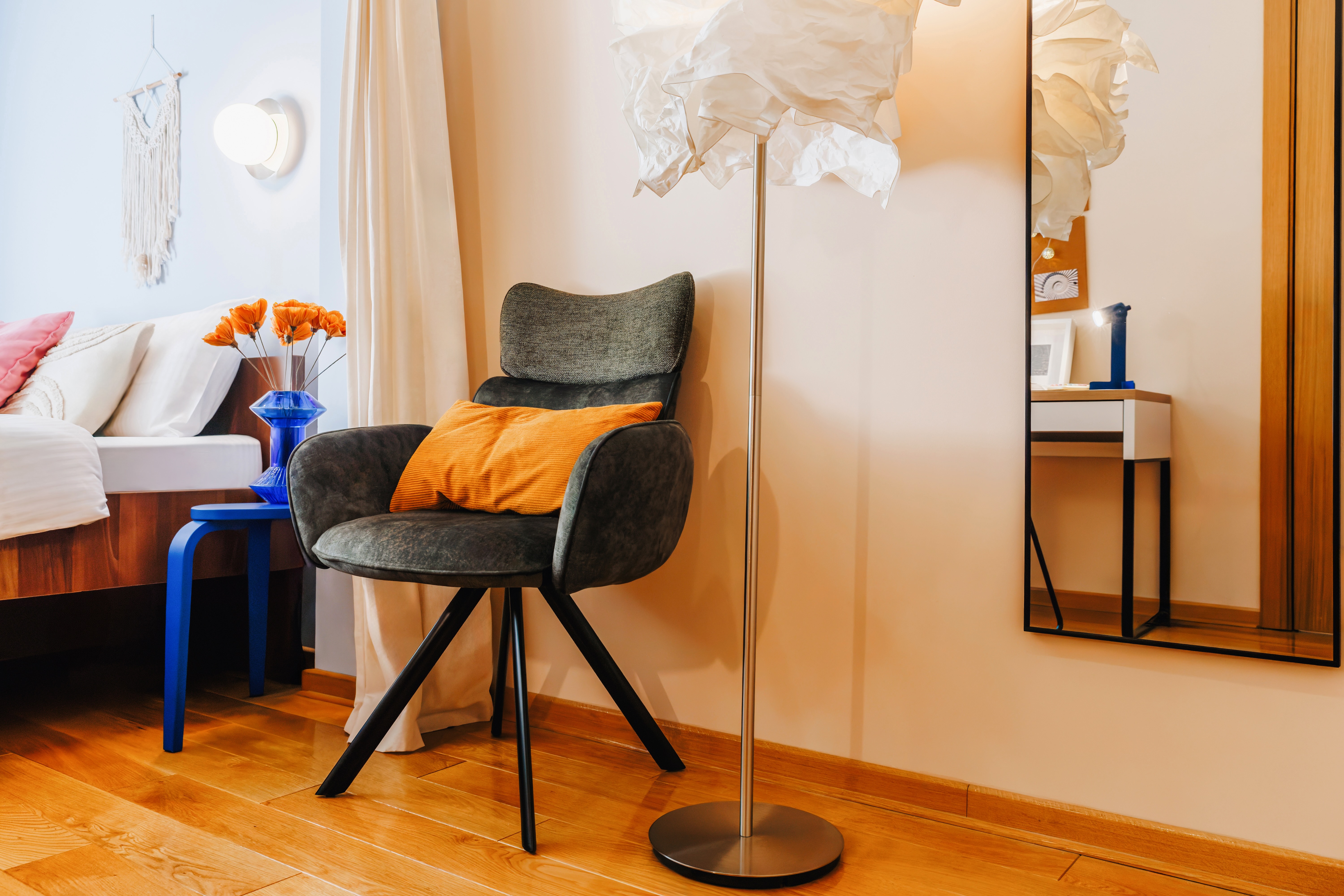 Cozy designer bedroom corner with warm lighting and stylish accents