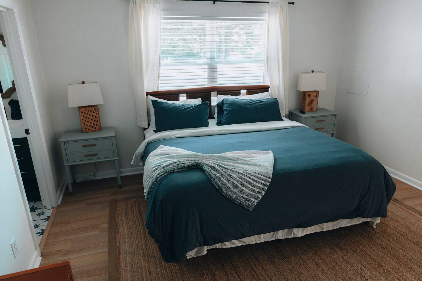 Bedroom with a king bed, matching nightstands and lamps