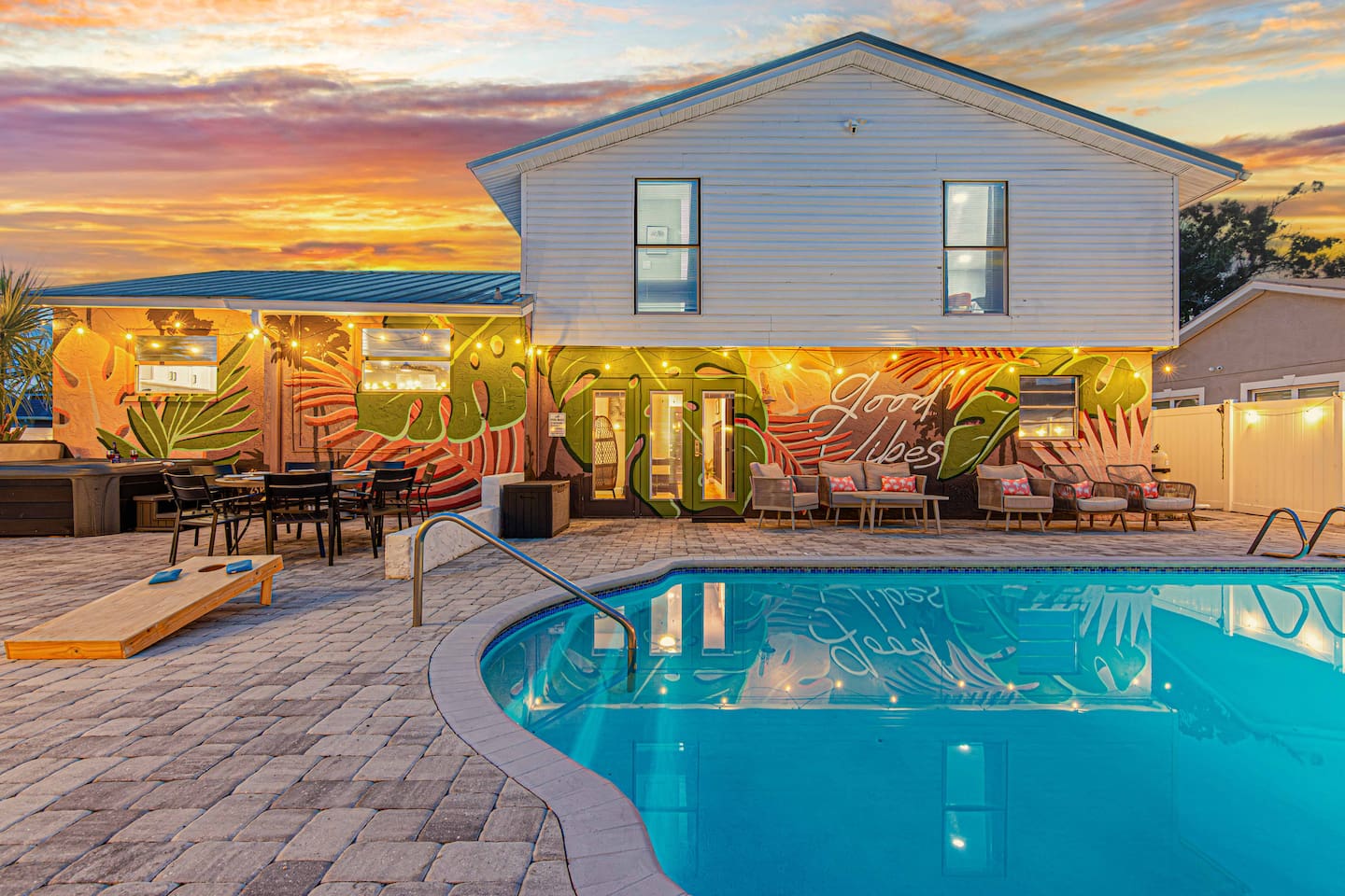The backyard: pool, hot tub, pickleball court, swings and games in every corner