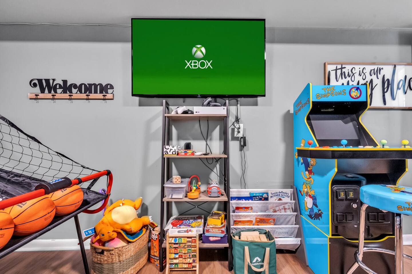 Pac-Man arcade, Xbox and gaming chairs in the game room