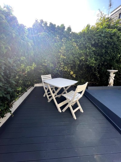 Step outside to your own private garden dining area in Shepherd's Bush, Greater London near Notting Hill, Acton & Ealing. Ideal for meals, relaxing or simply enjoying the greenery.