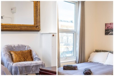 Elegant bedroom with plush armchair, gold accents, and bright natural light.