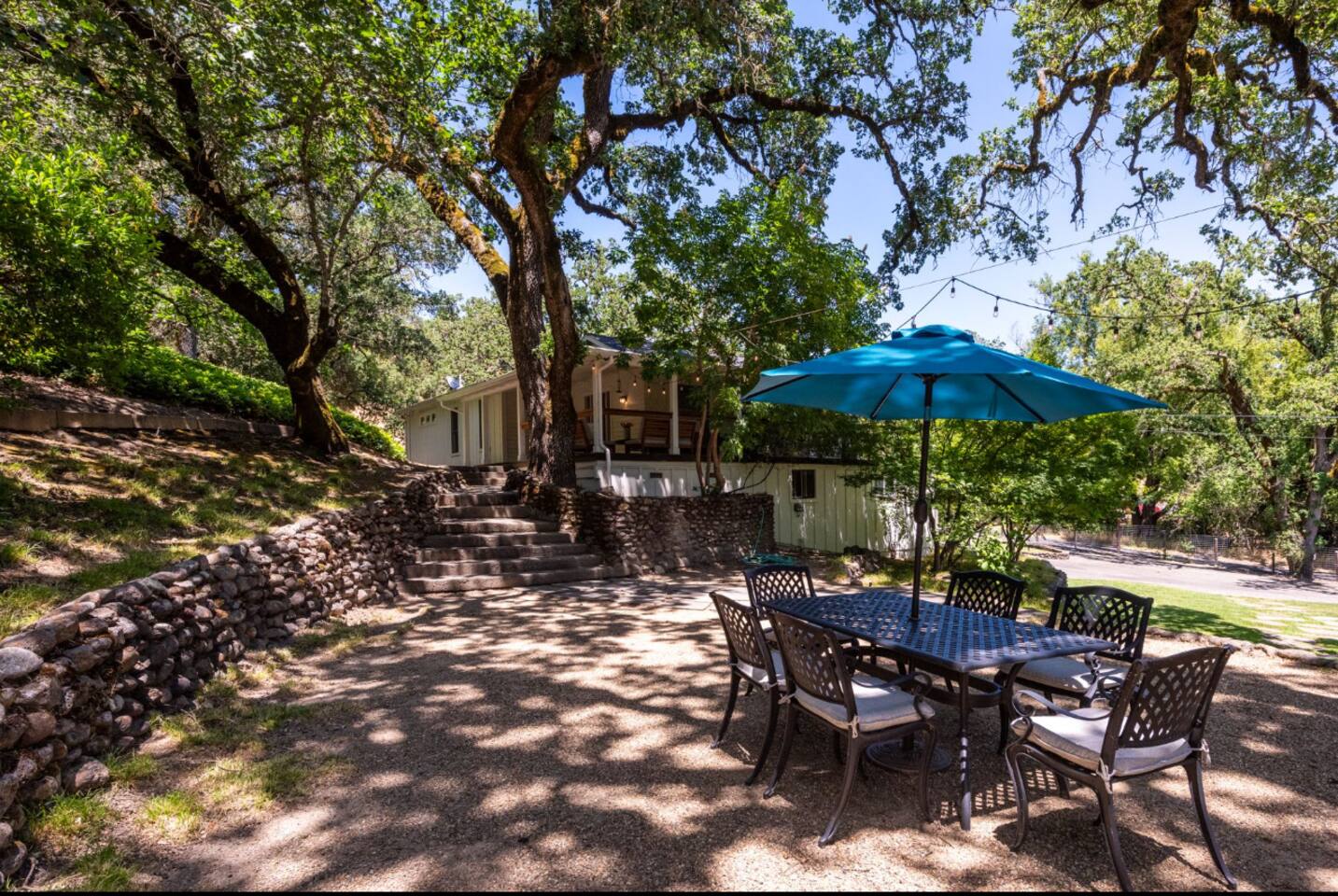 Gather around the outdoor table for casual meals, from breakfast to sunset dinners.