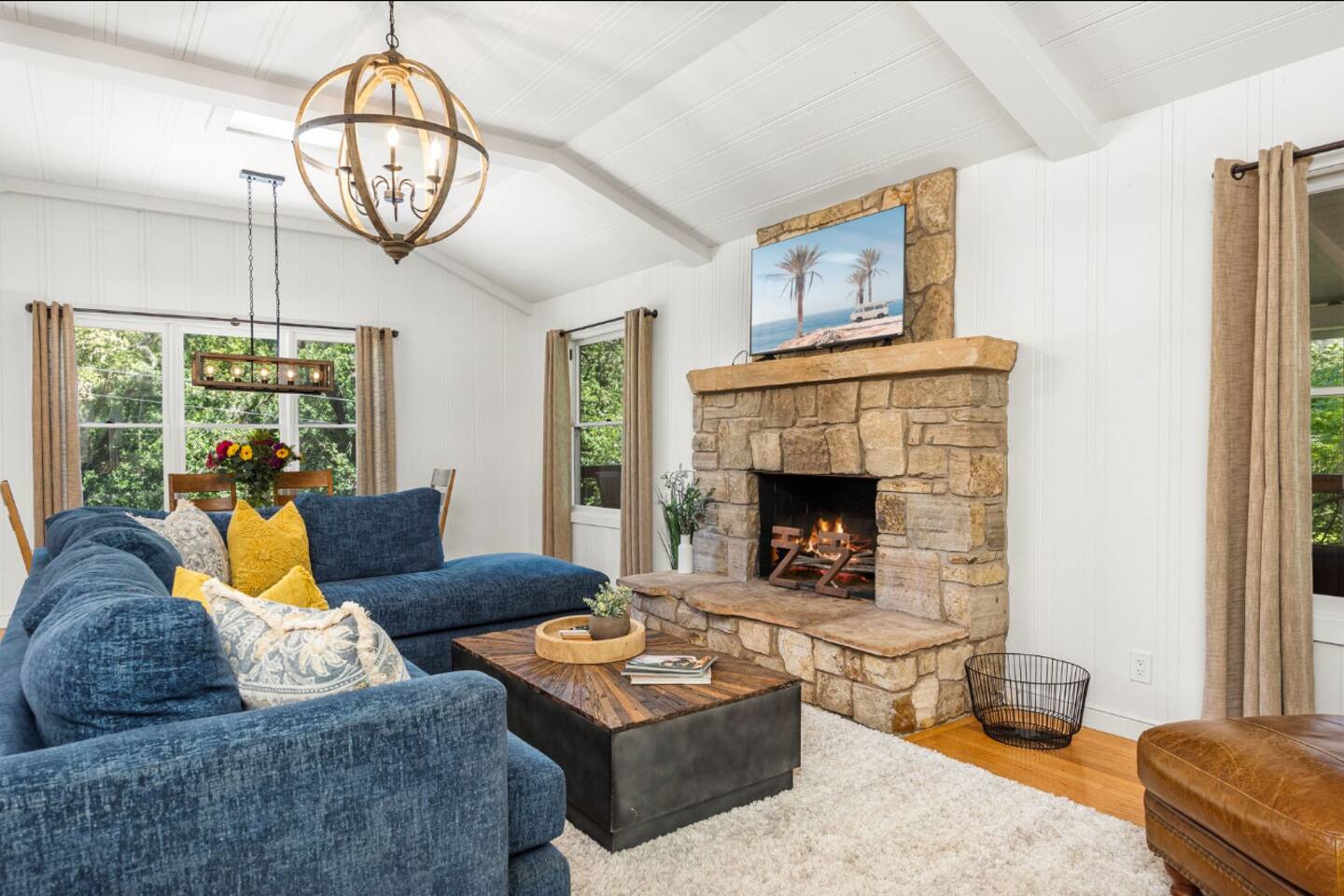 Kick back and relax on the large, inviting couch, perfect for movie marathons on the smart TV. (Fireplace has been decommissioned to maintain the air quality of the house). 