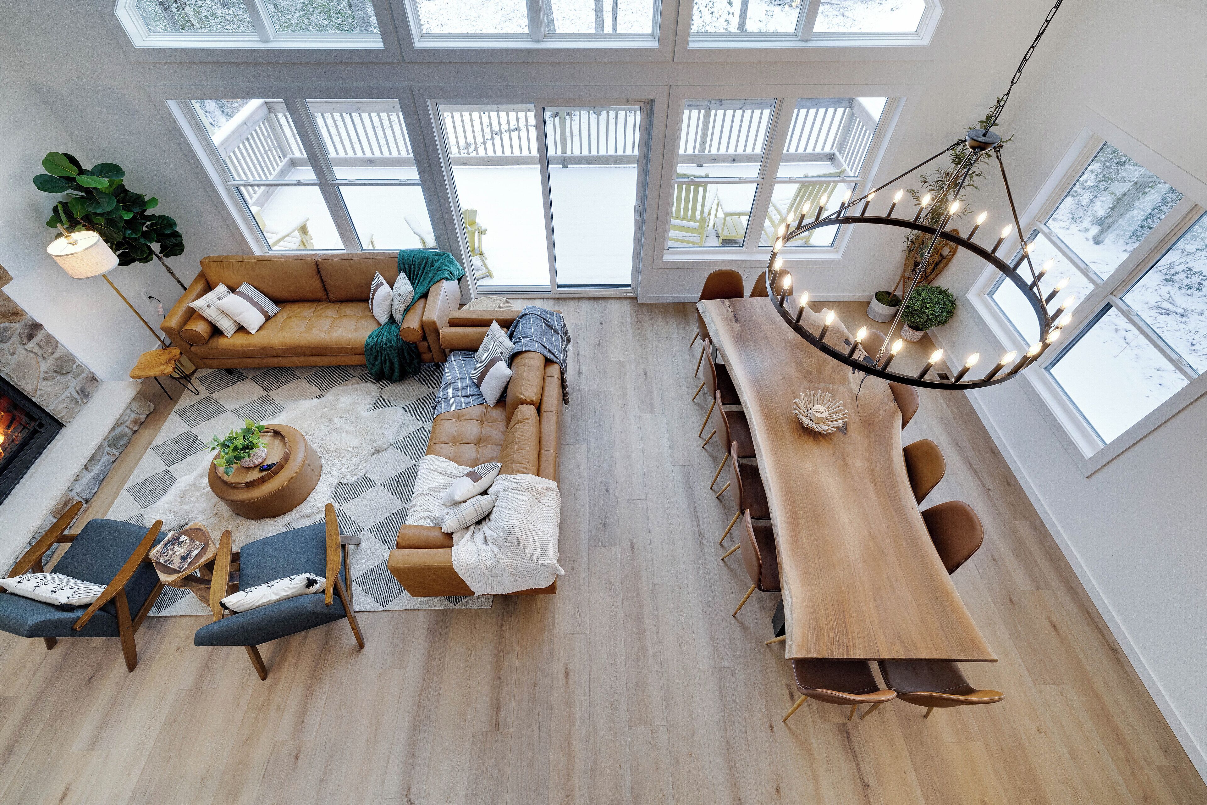 Floor to ceiling windows offer abundant light in the dining and living areas.