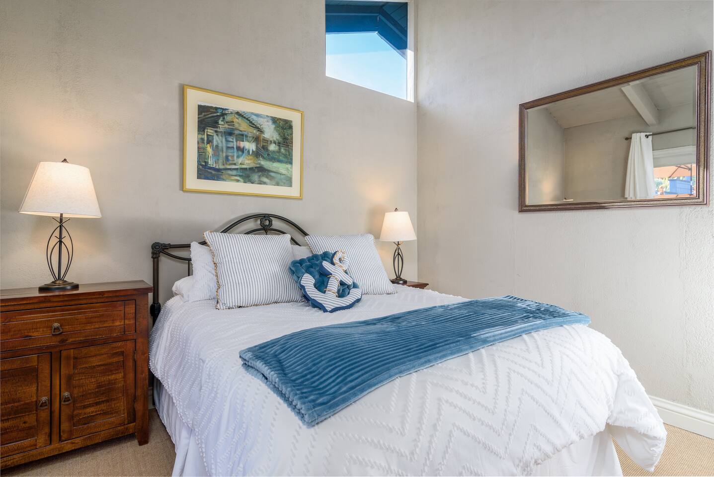 Relax and unwind in the cozy queen bedroom, offering a perfect blend of comfort and style for a restful night’s sleep.