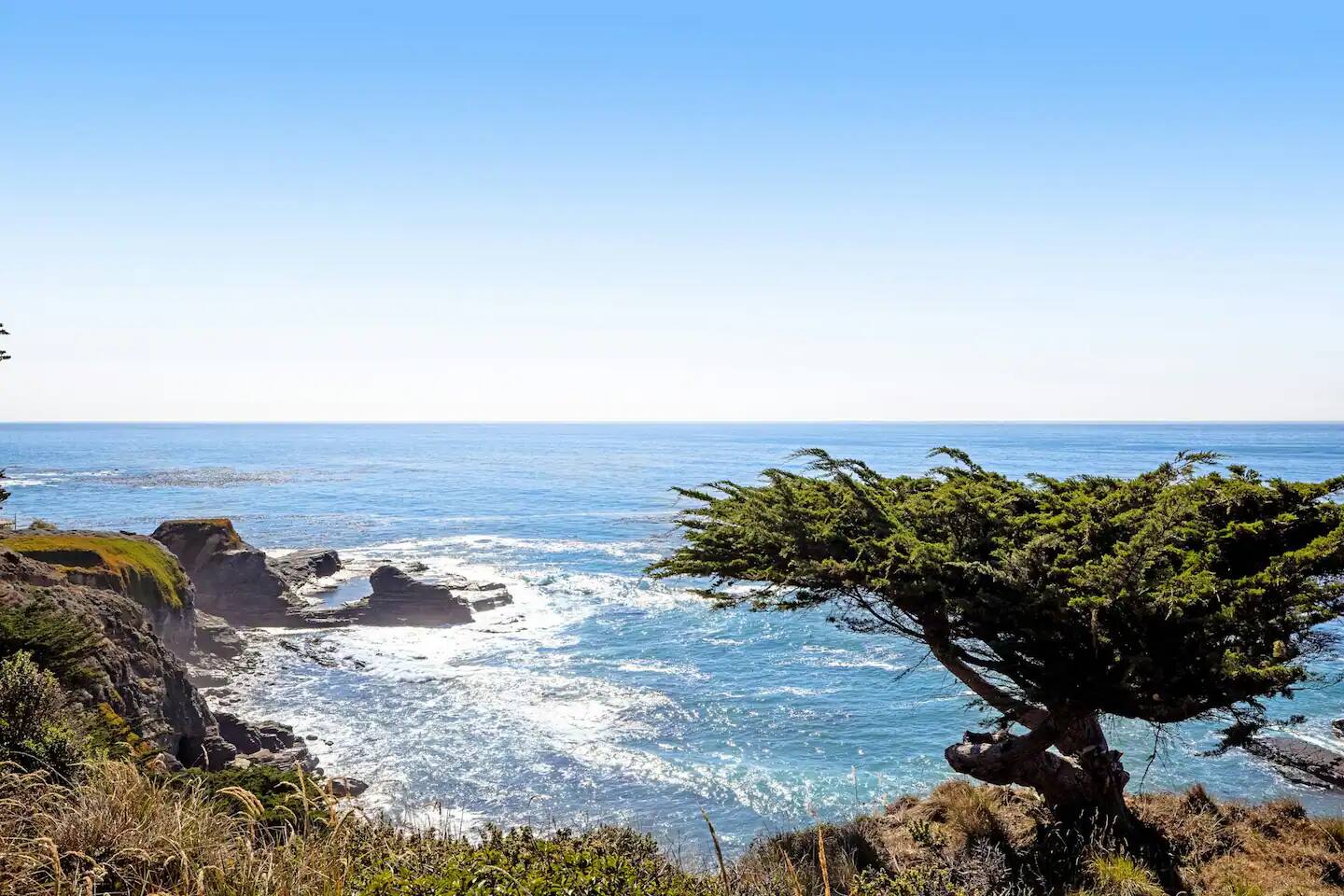 Marvel at the stunning ocean view from the cliffside, a breathtaking blend of rugged beauty and serene blue waters.