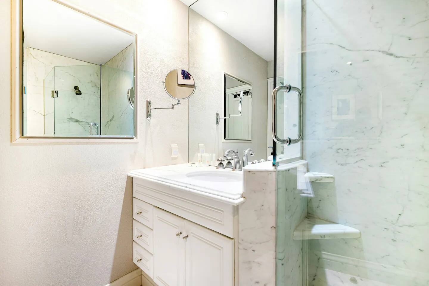 Additional mirrors have been thoughtfully added, making it easy to get ready for the day with convenience and style.