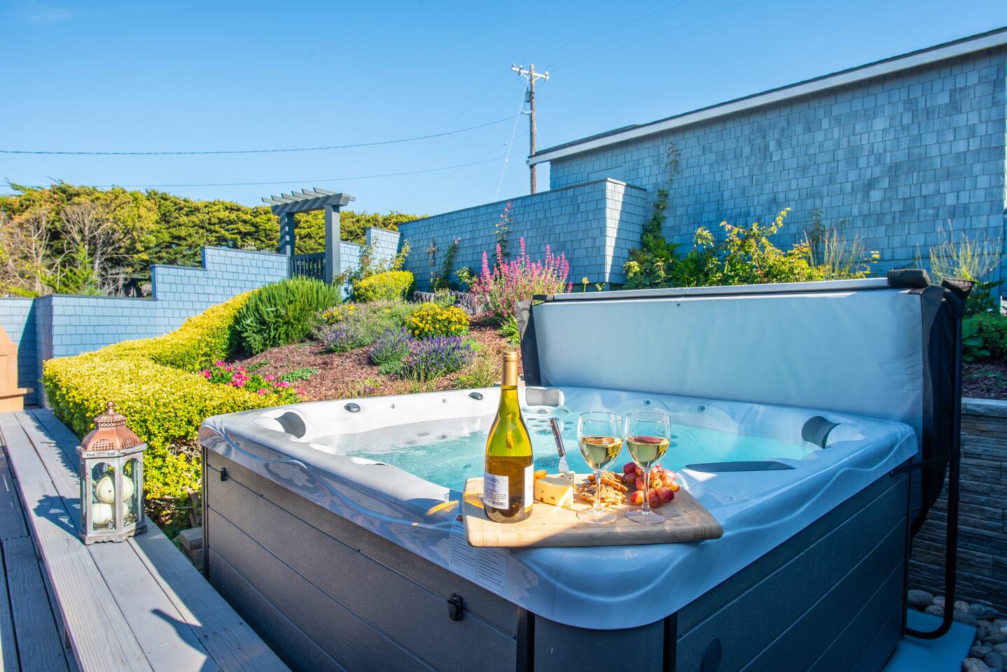 Wine not? Sink into your private hot tub, surrounded by lush greenery and the soothing sounds of nature. It's the ultimate spot to unwind after a day of adventure and exploration.