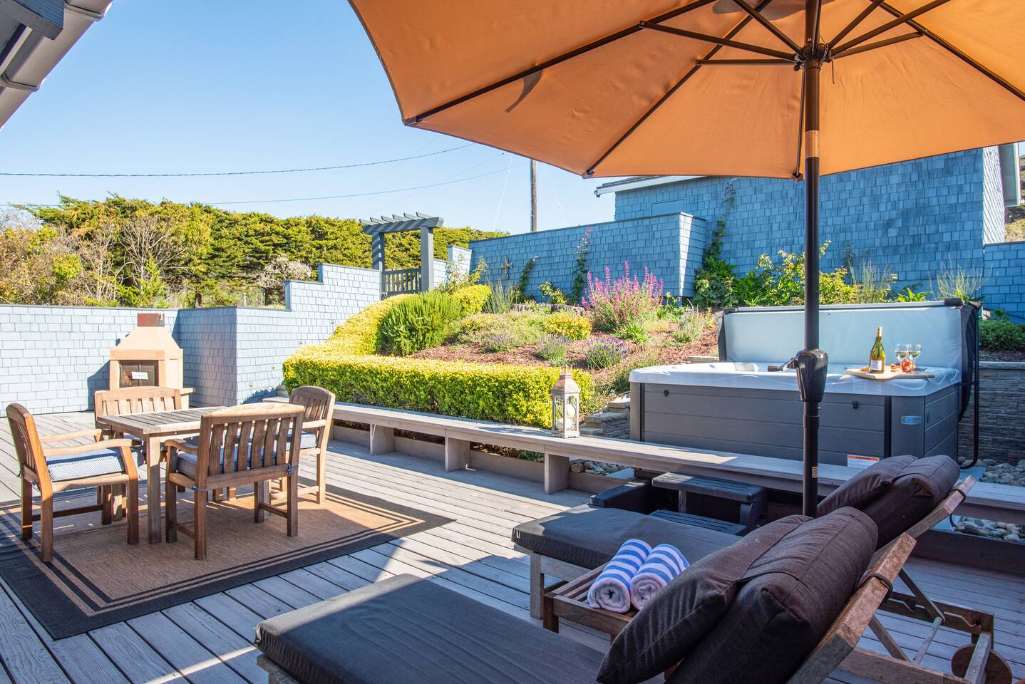 Your private outdoor escape awaits—soak in the hot tub, savor meals by the BBQ, and unwind surrounded by blooming gardens and coastal breezes.