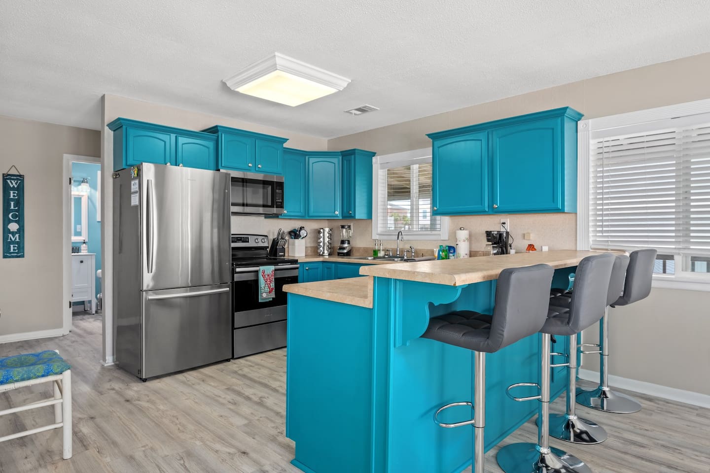 Kitchen with bright blue cabinets