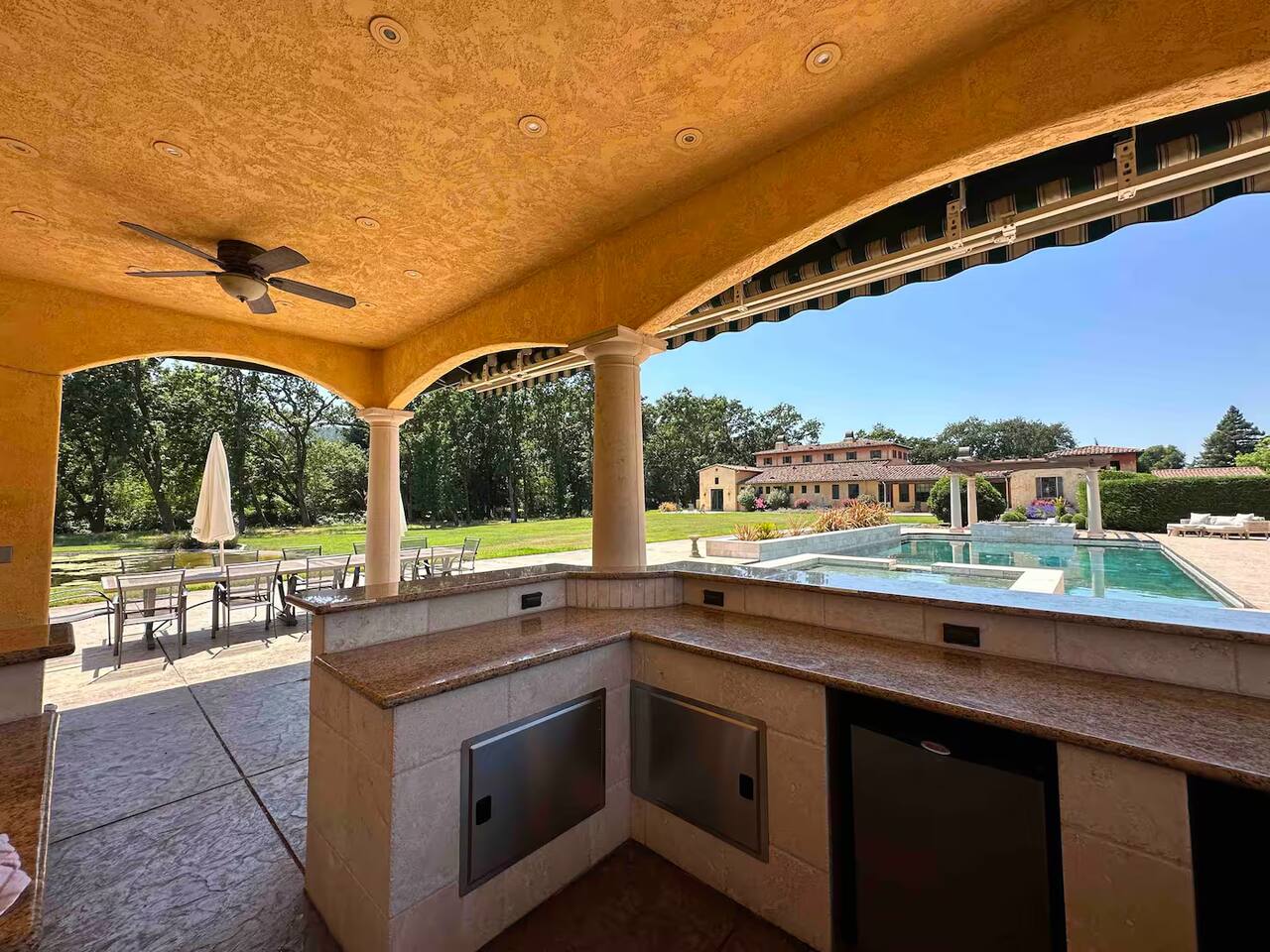 A convenient outdoor kitchenette, perfect for whipping up a delicious feast while enjoying the poolside breeze.