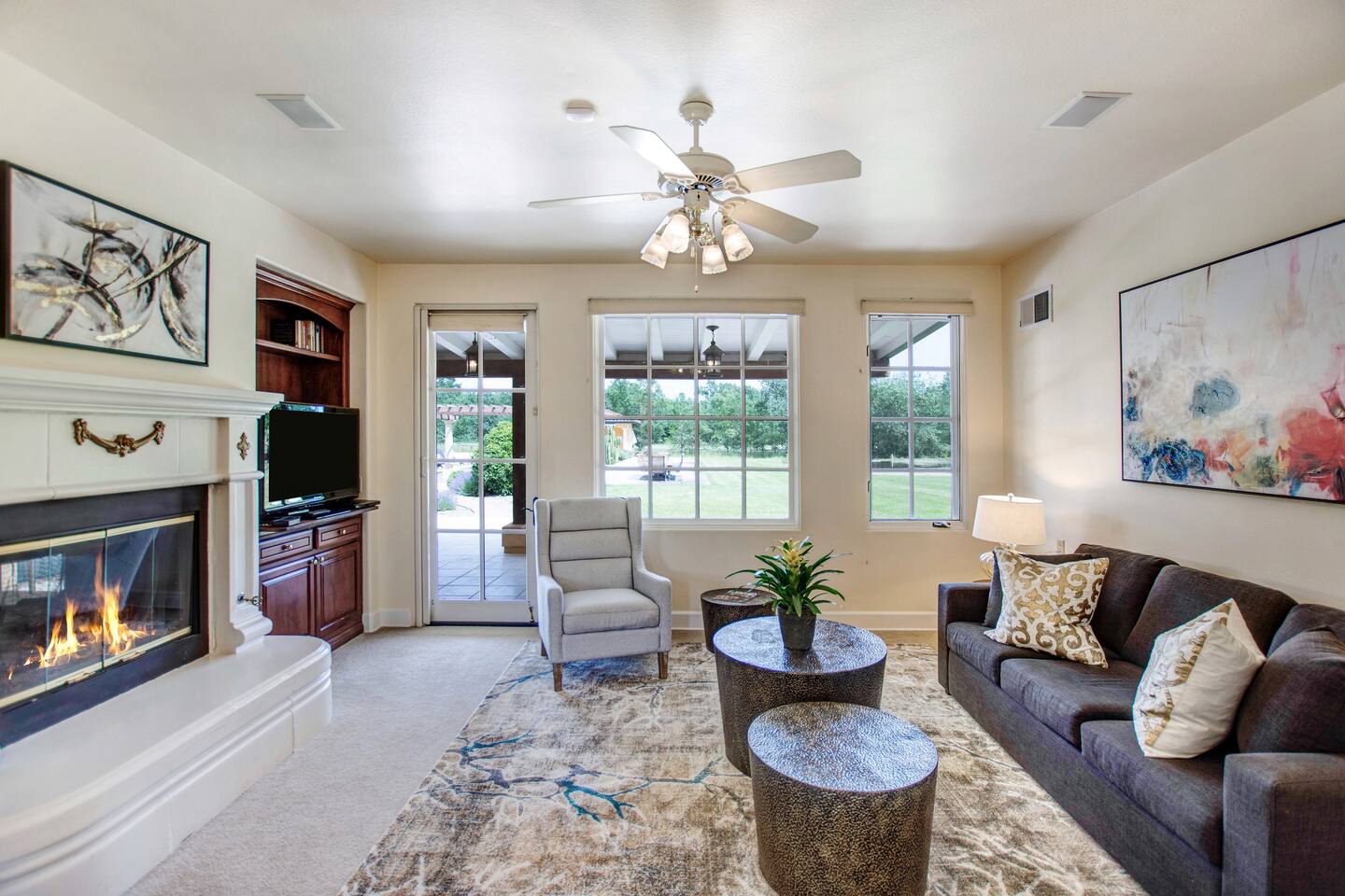 Cozy up by the fireplace and enjoy the TV, creating the perfect setting for a relaxing hangout with family and friends.