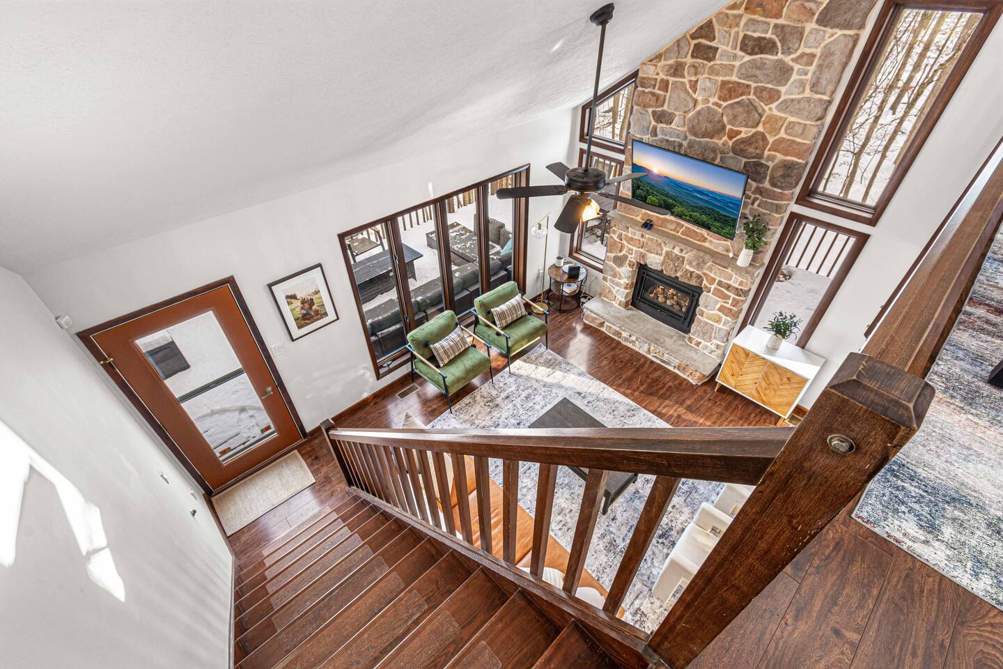 Bright living area with expansive windows framing the lake