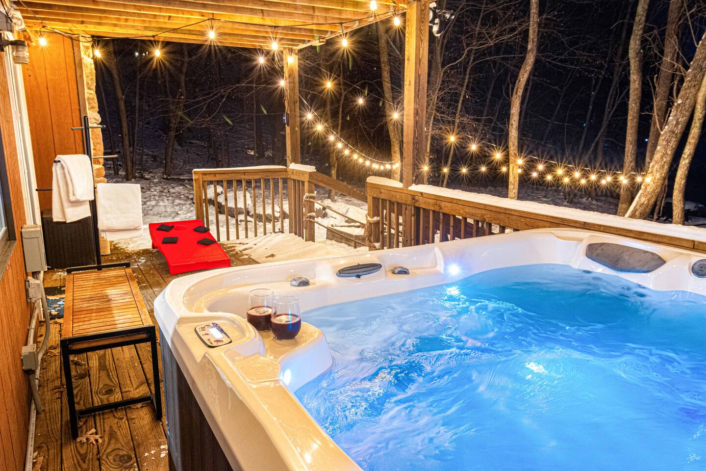 Hot tub glowing under the evening sky by the lake