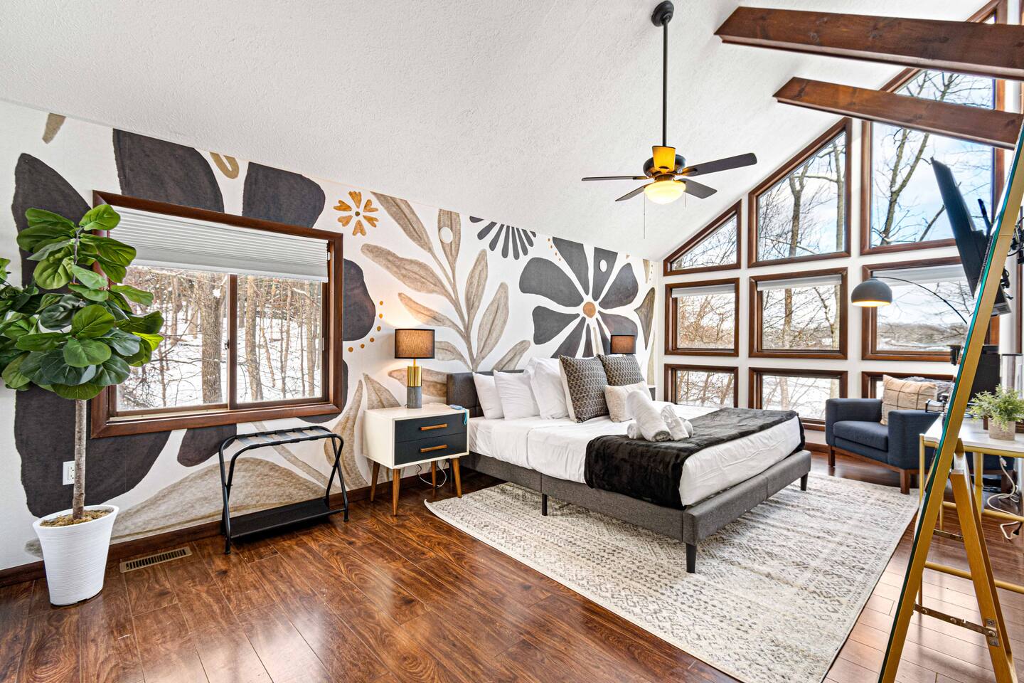 Master bedroom with a king bed and lake views