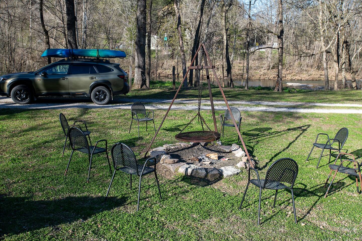 This property offers a perfect outdoor space for relaxation and gathering around a cozy fire pit. Surrounded by nature and just steps away from the peaceful buffalo river