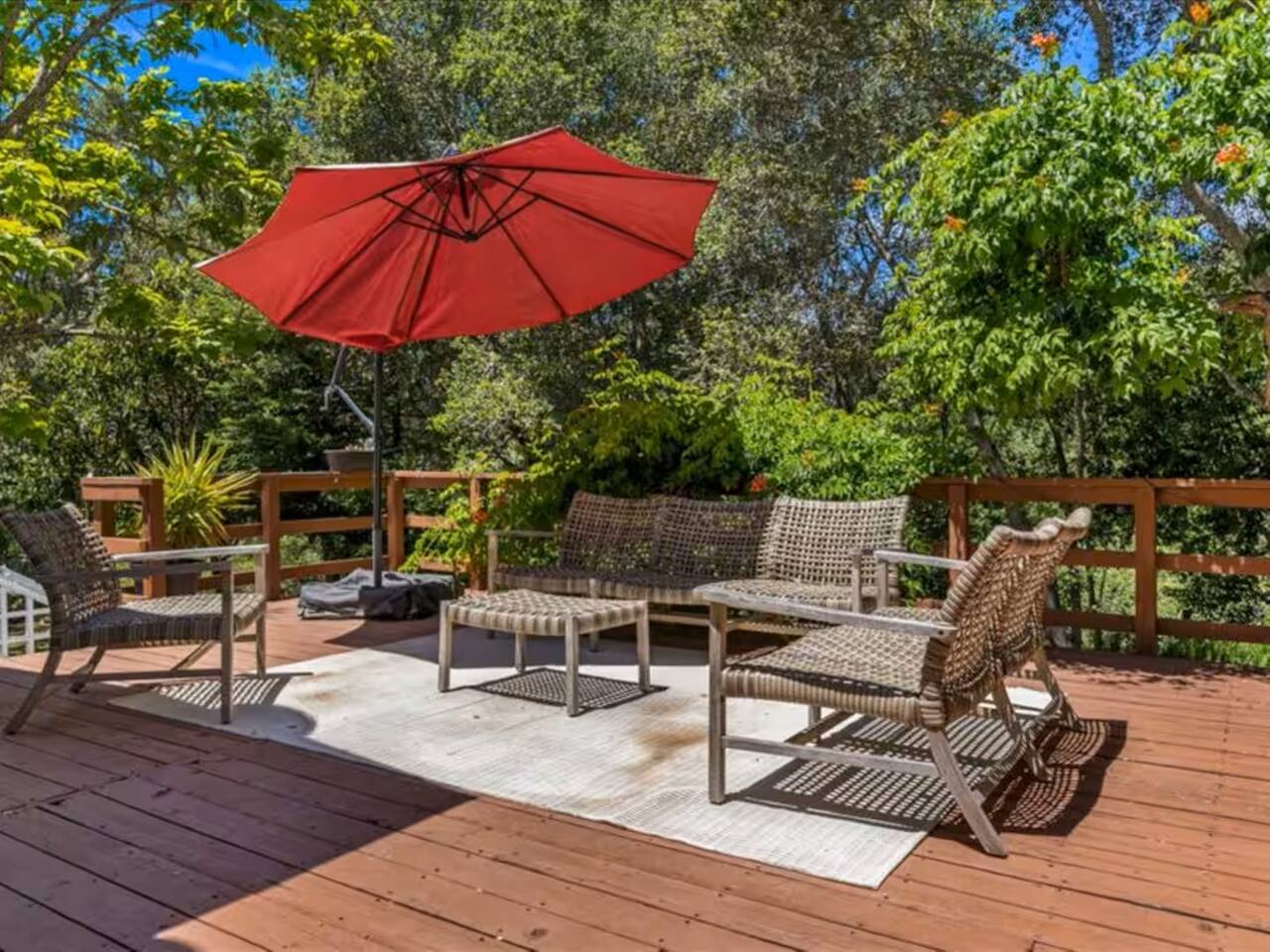 Relax and unwind in the inviting outdoor seating area on the patio, perfect for enjoying the fresh air and peaceful surroundings.