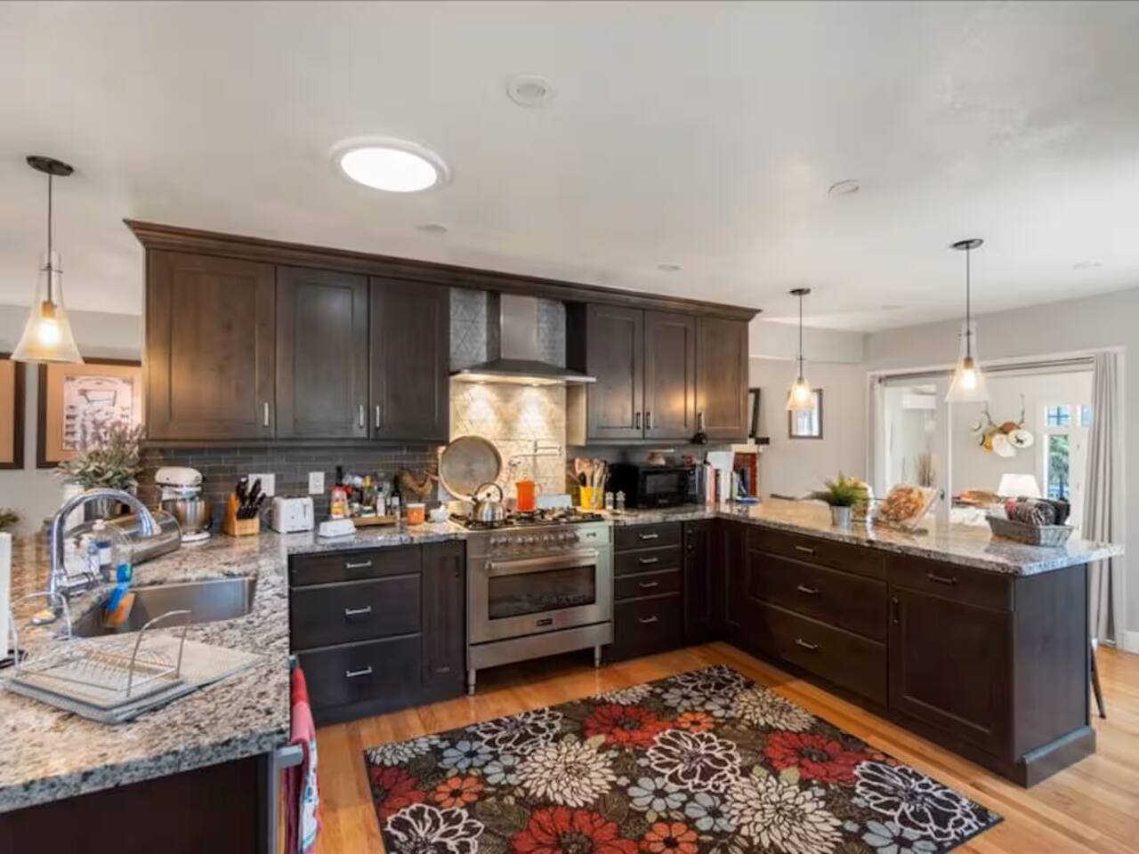 The conveniently located kitchen is a chef's dream, boasting a spacious marble countertop that's perfect for preparing culinary masterpieces.
