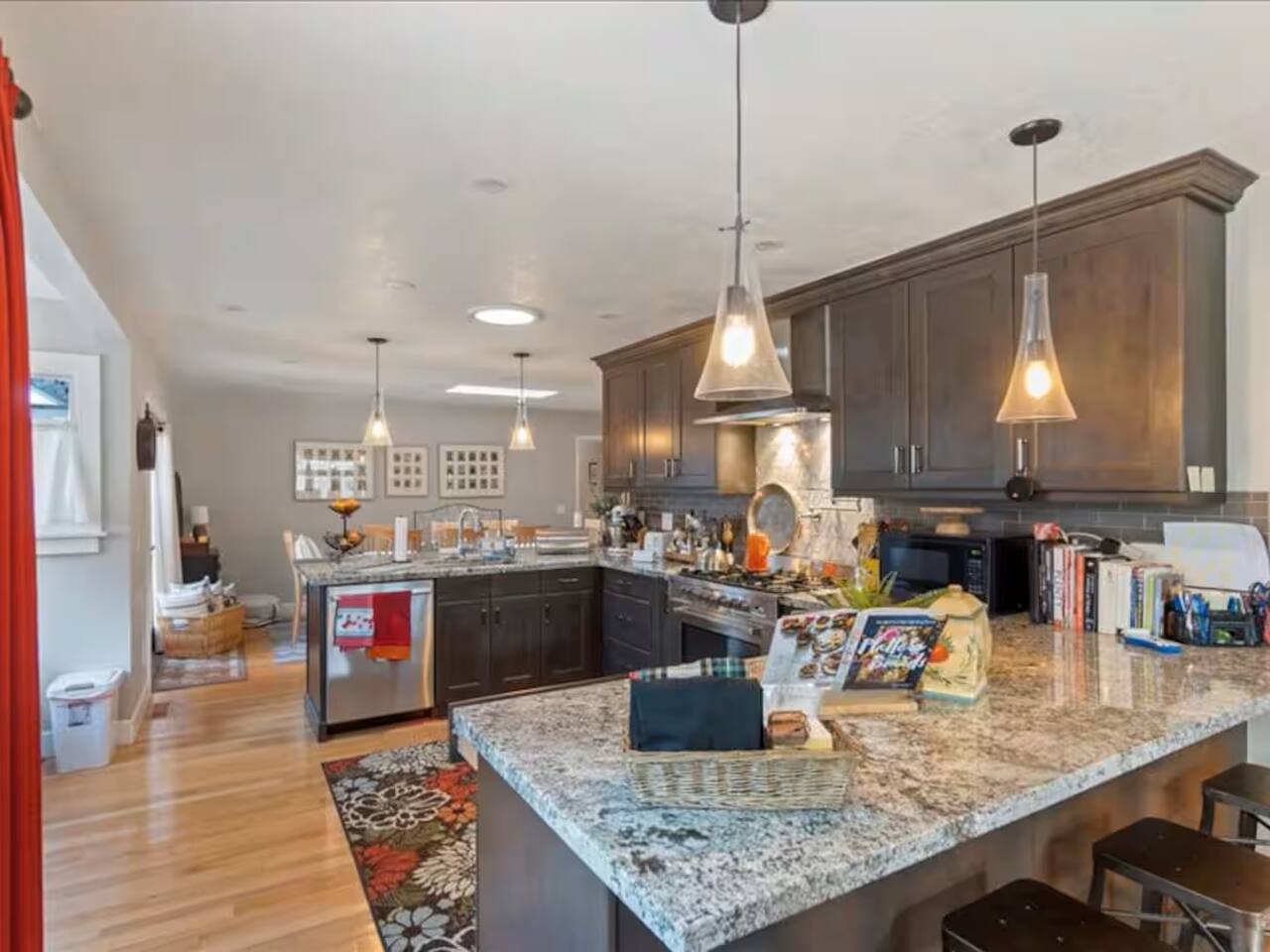 The conveniently located kitchen is a chef's dream, boasting a spacious marble countertop that's perfect for preparing culinary masterpieces.