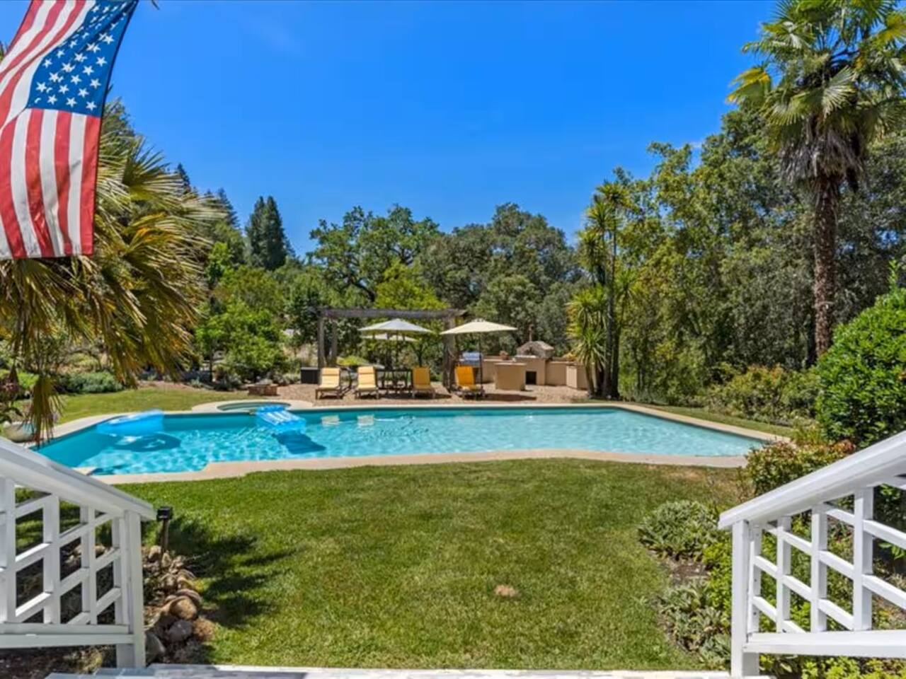 Step out into the inviting backyard where you can take a dip in the sparkling pool or just walk around and enjoy the tranquility of the surroundings