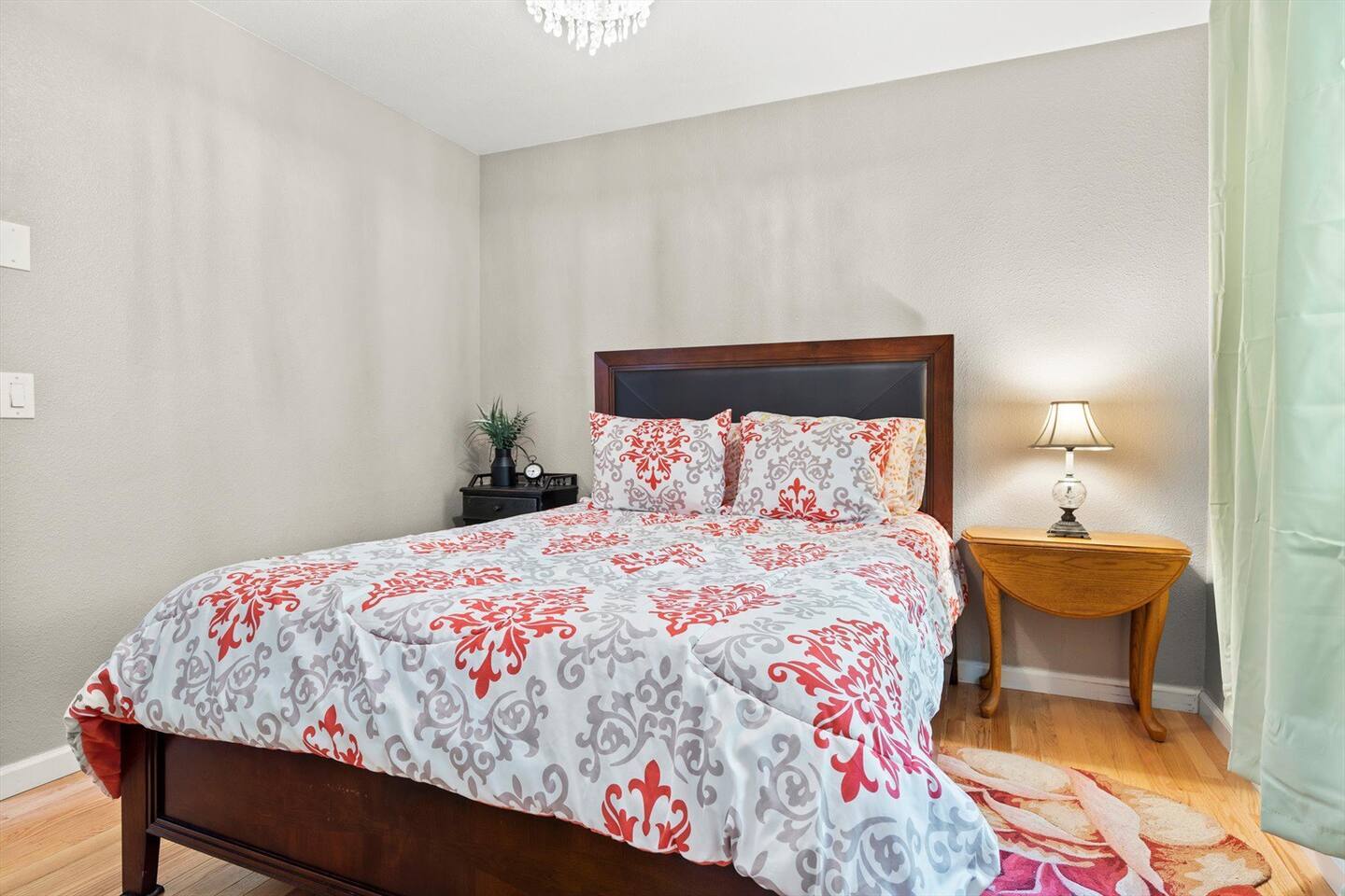 Relax in the comfortable queen bed, offering a cozy and peaceful retreat for a restful night's sleep.