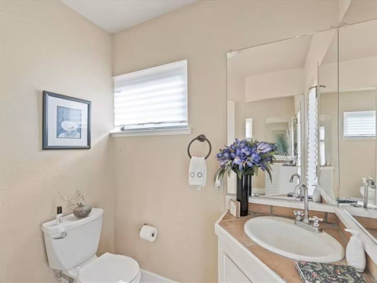 The half bathroom offers convenient access for quick touch-ups and refreshes during your stay.