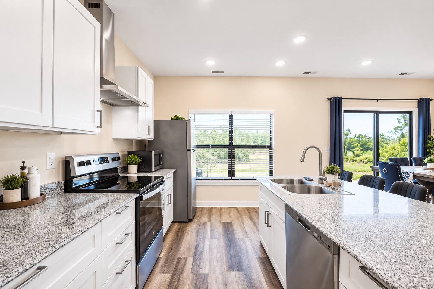 This fully equipped kitchen features sleek countertops, stainless steel appliances, and ample storage, perfect for all your cooking needs.