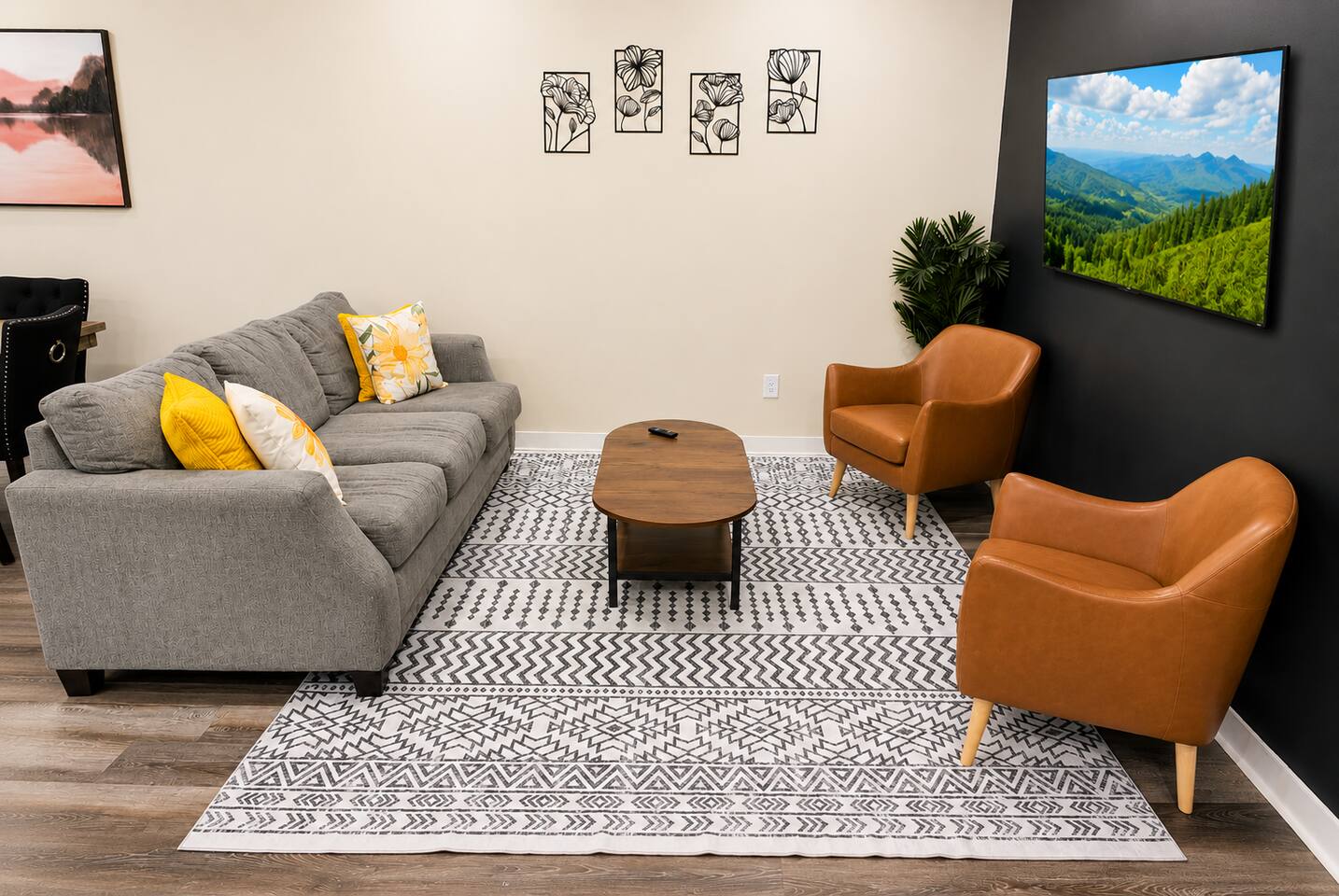 ✨ Kick back and unwind in this bright, comfortable living room featuring cozy seating and a large Smart TV