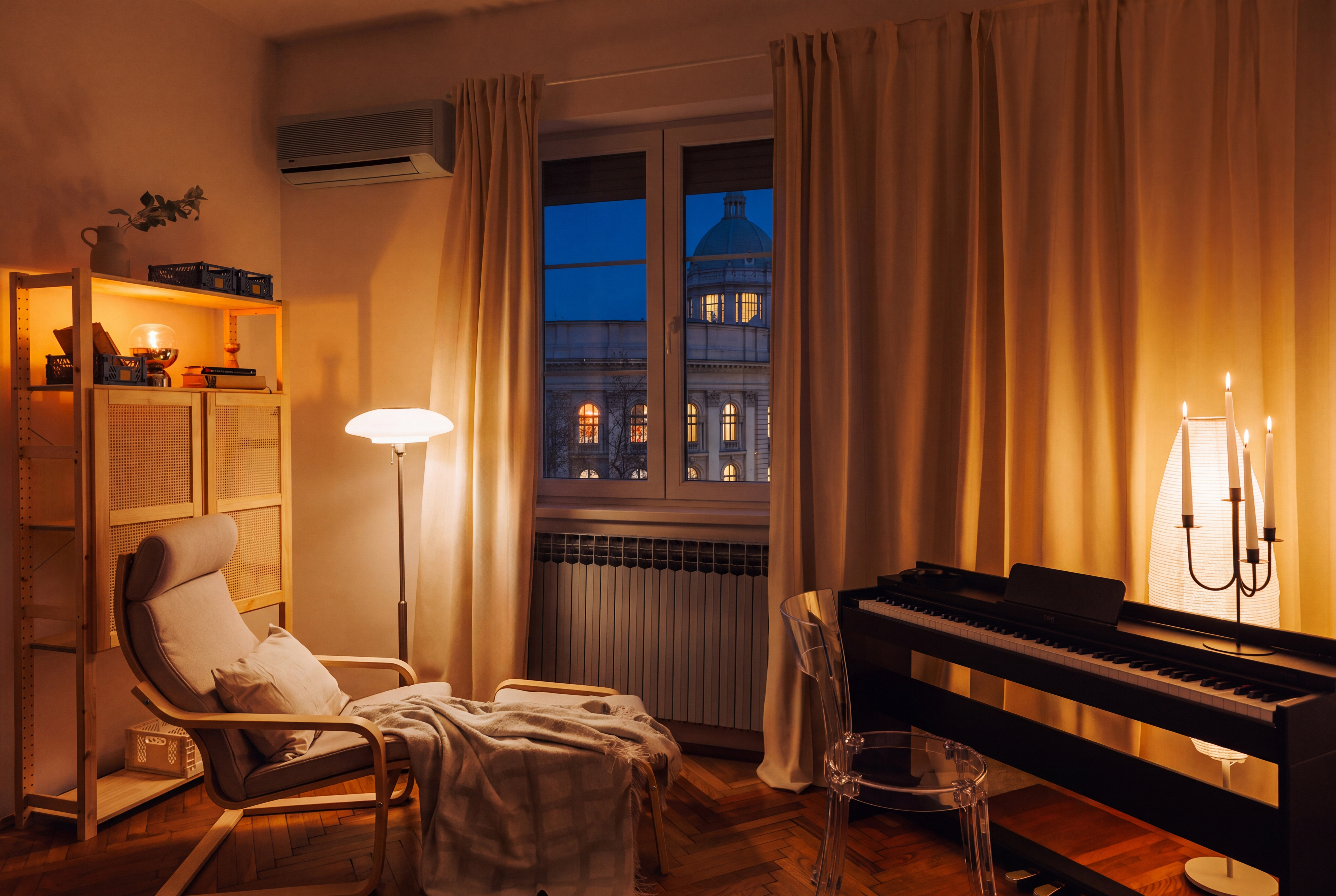 Cozy designer lounge with piano and stunning evening city view