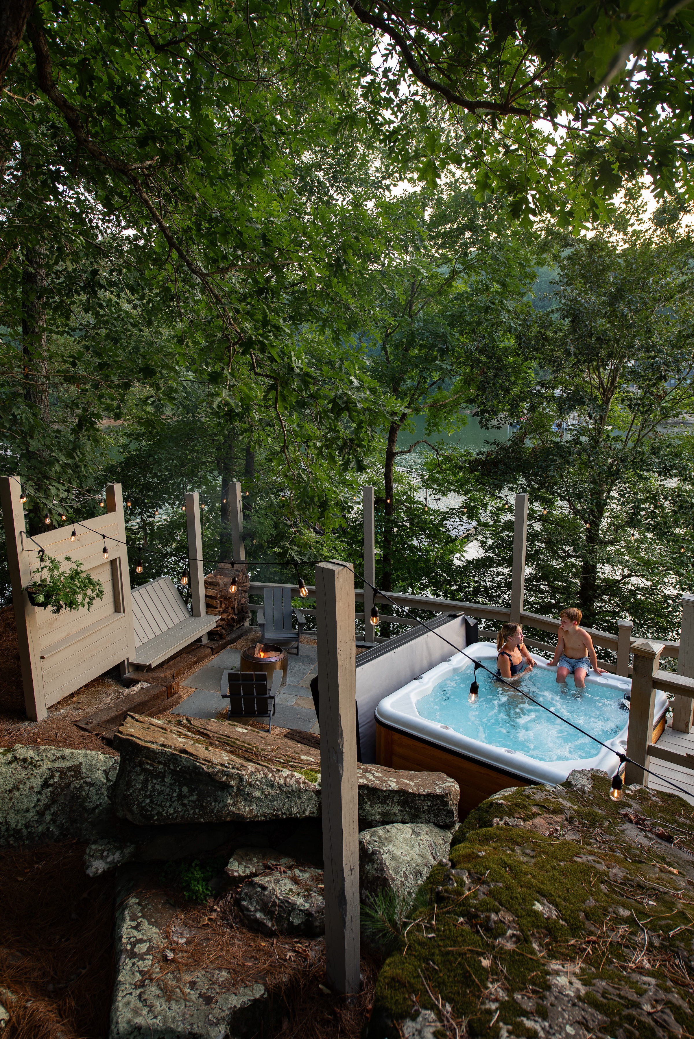 Hot tub, fire pit with Solo Stove and outdoor shower are all accessed by the extended walkway along the lower deck.