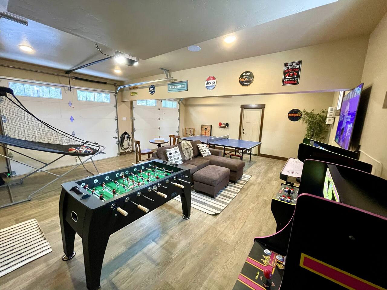 Game room packed with fun—foosball, ping pong, basketball hoop, air hockey and classic arcade games—plus a comfy sectional sleeper sofa for movie nights or post‑play lounging. Perfect for all‑ages entertainment from morning to midnight.