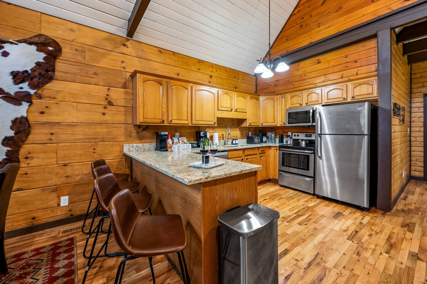 Kitchen with granite counters, a breakfast bar and stainless appliances