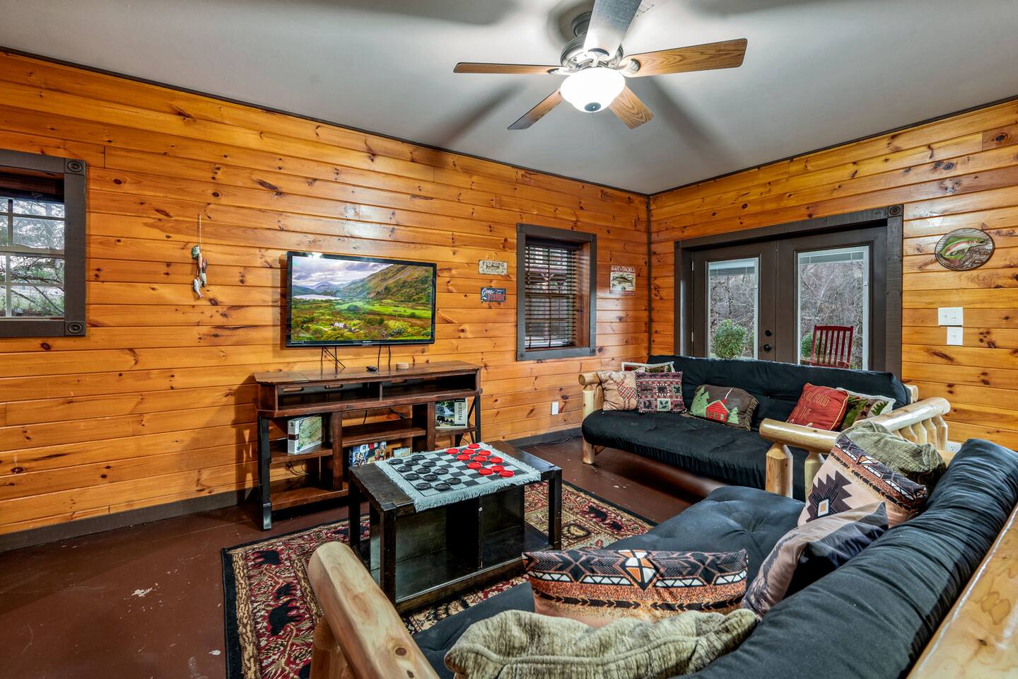 Second living room with a sectional sofa and a TV