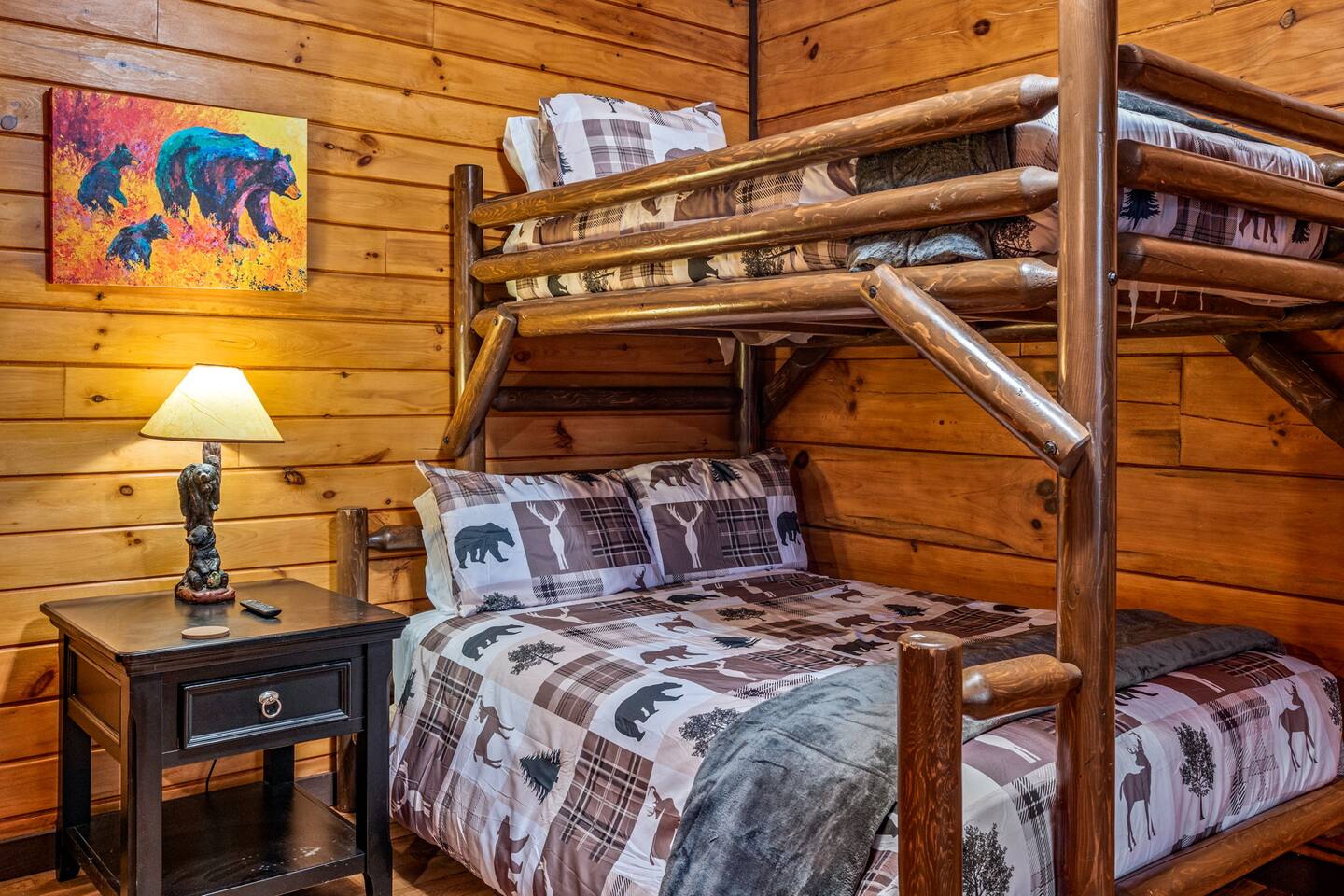 Log bunk beds with bear-print bedding