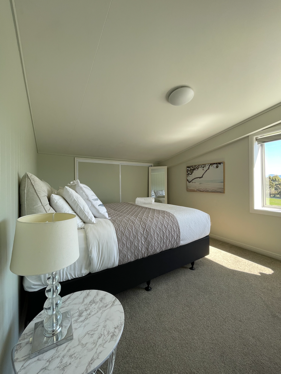 Bedroom 2 Bright, serene bedroom with plush queen bed, 1 king-single and trundle bed with lovely natural light
