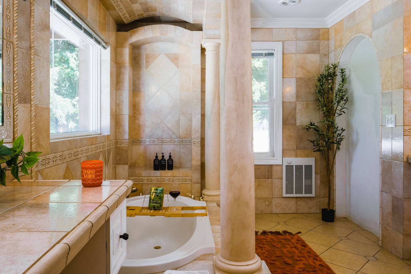 Unwind in this European-style bathroom, designed for both elegance and practicality. The spacious bathtub offers a perfect spot for relaxation.