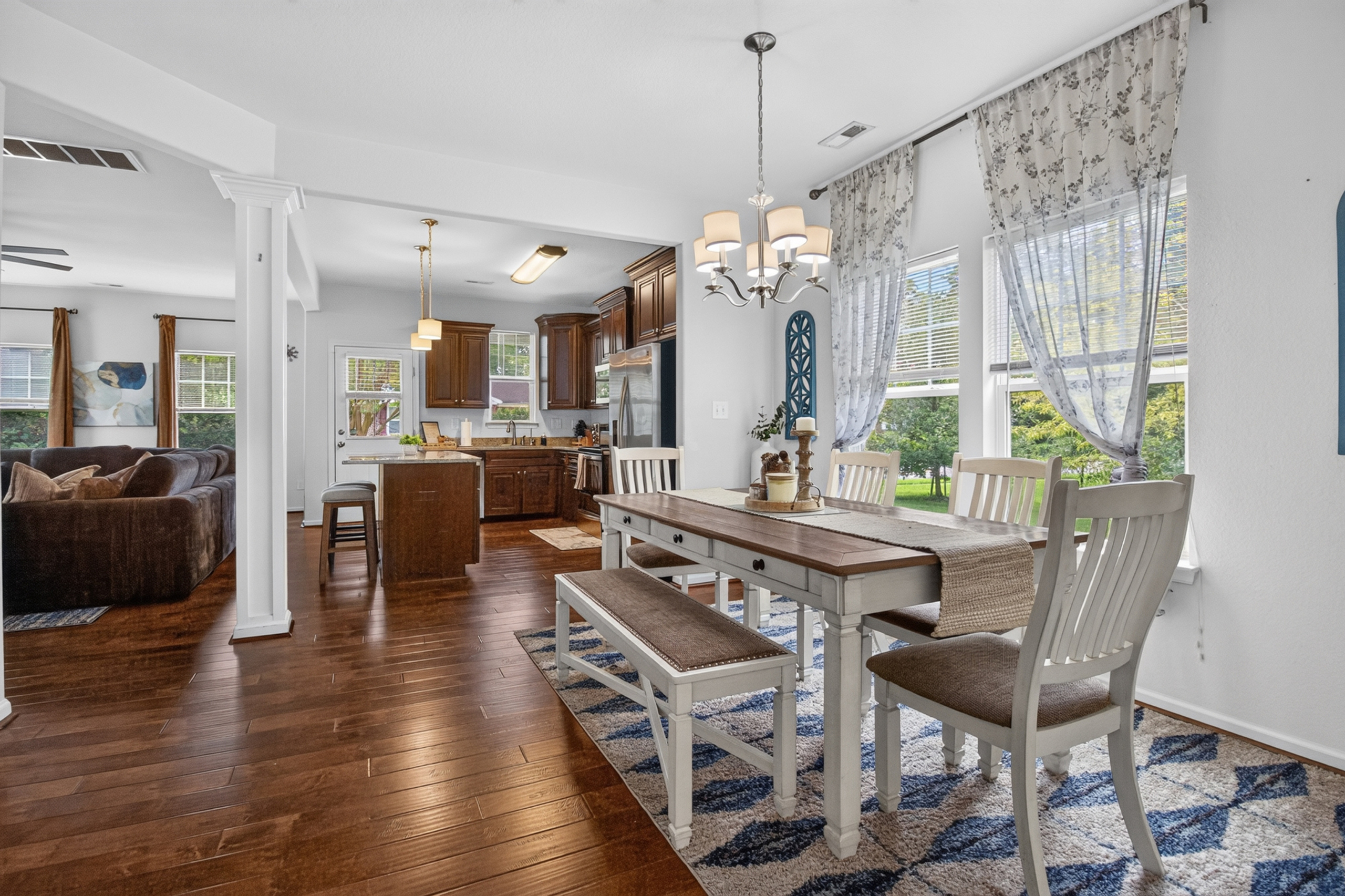 Bright open dining space with stylish kitchen and plenty of natural light