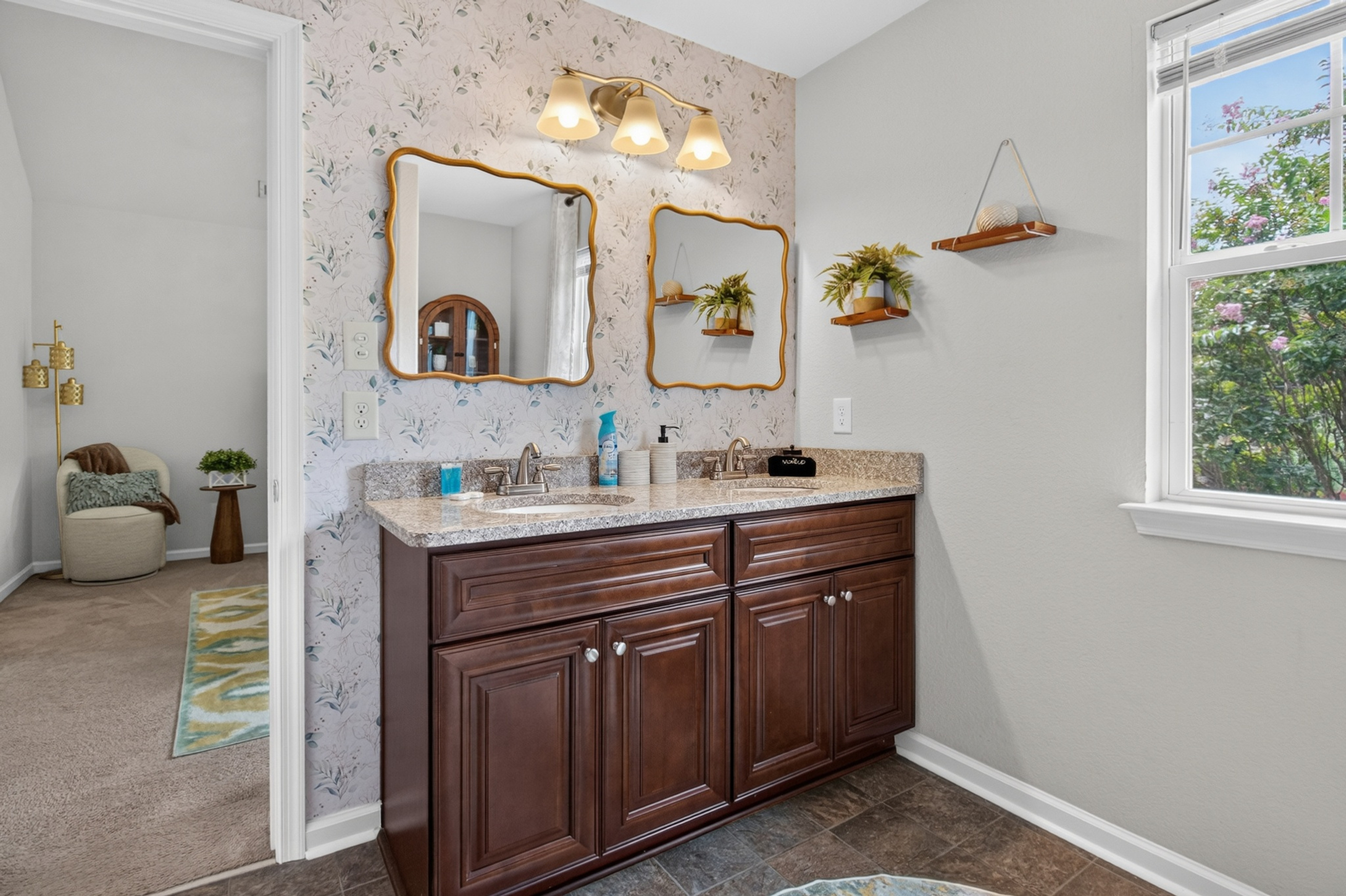 Bright double vanity bathroom with elegant finishes and natural light