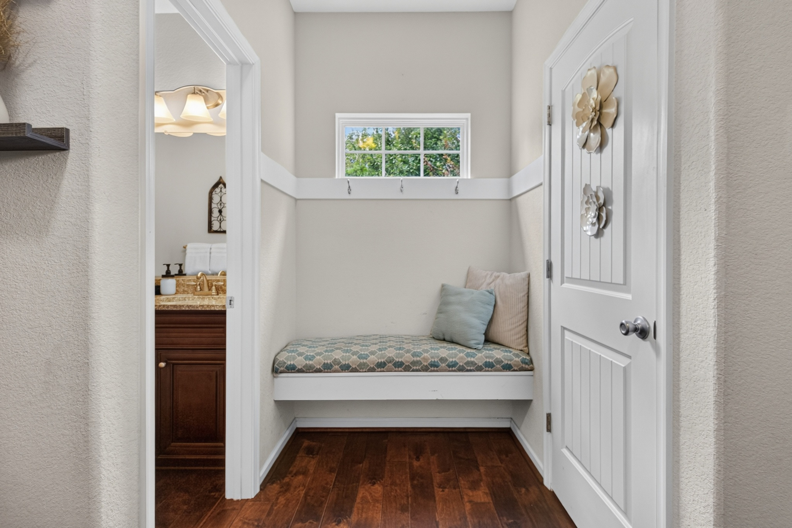 Cozy built-in bench nook with natural light and stylish entryway charm